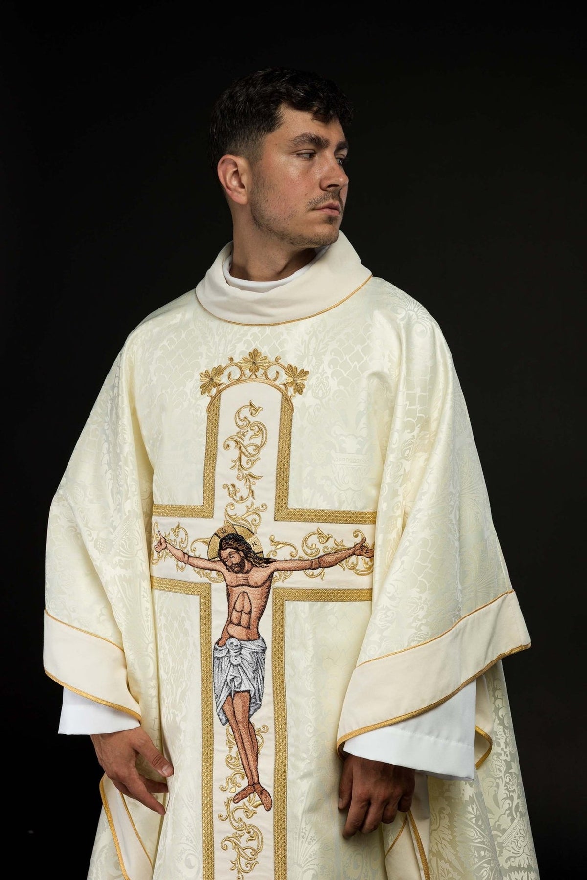 Ecru chasuble front close-up with embroidered Jesus Christ on the cross