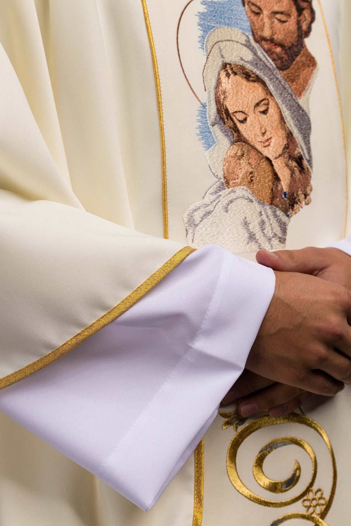Holy Family chasuble, detail of gold scroll embroidery and white fabric