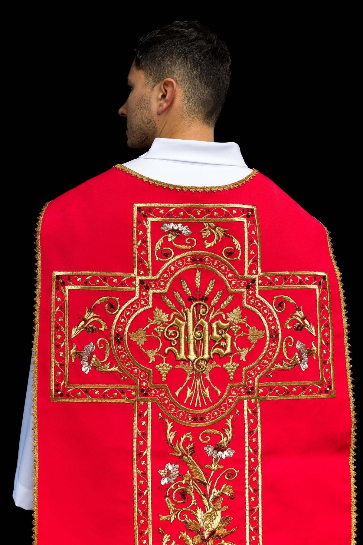 Red Roman chasuble close-up of back embroidered IHS motif and gold floral details