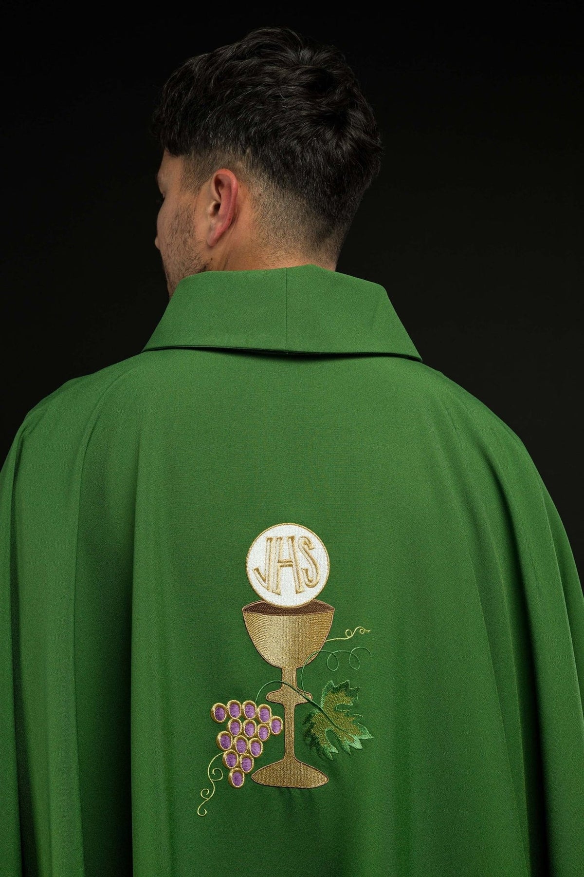 Green chasuble back view with embroidered gold chalice and grapes
