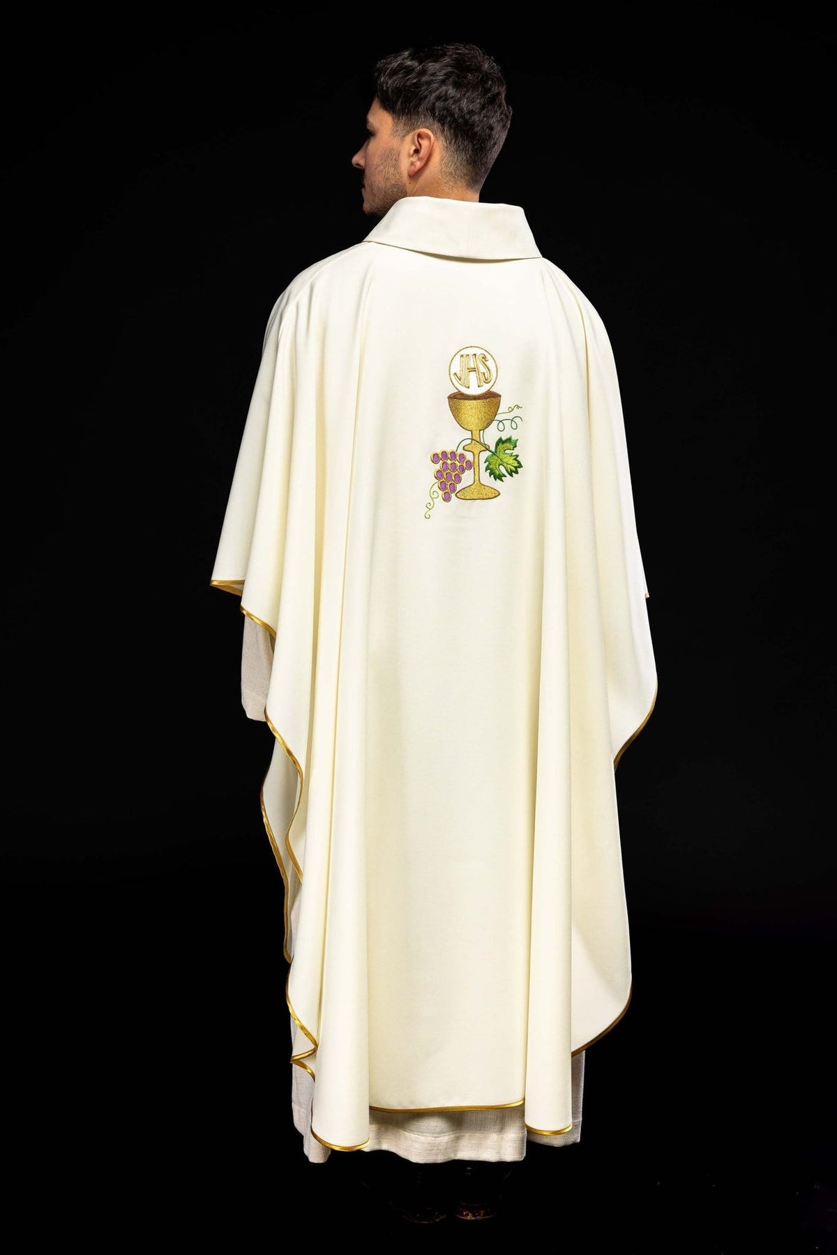 Chasuble back view showing centered IHS, chalice and grapes embroidery