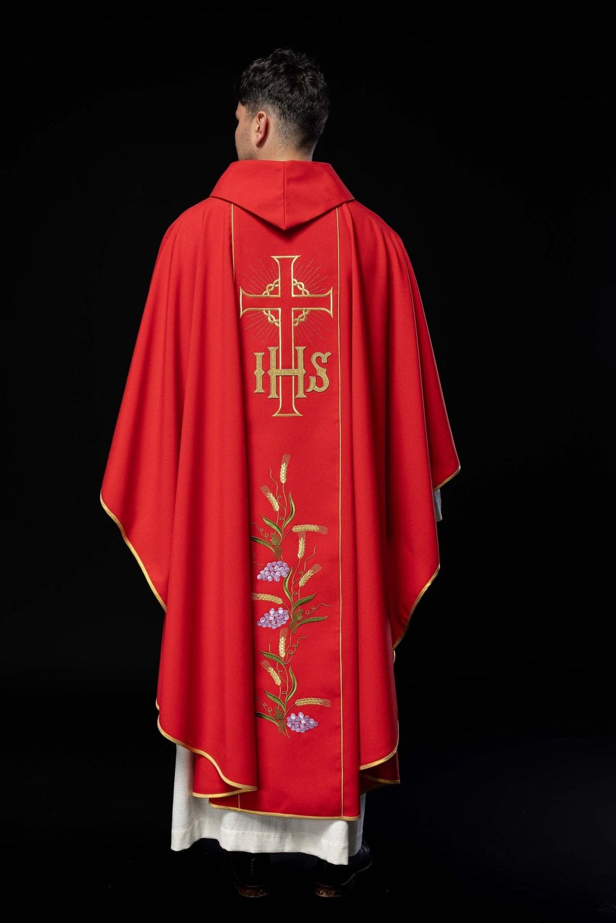Red chasuble back view with gold cross, IHS and embroidered orphrey