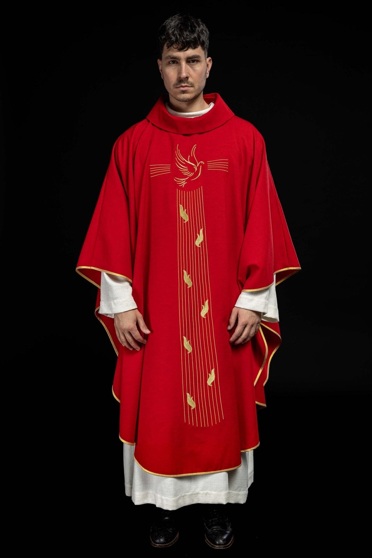 Red chasuble front view with gold trim and Holy Spirit embroidery