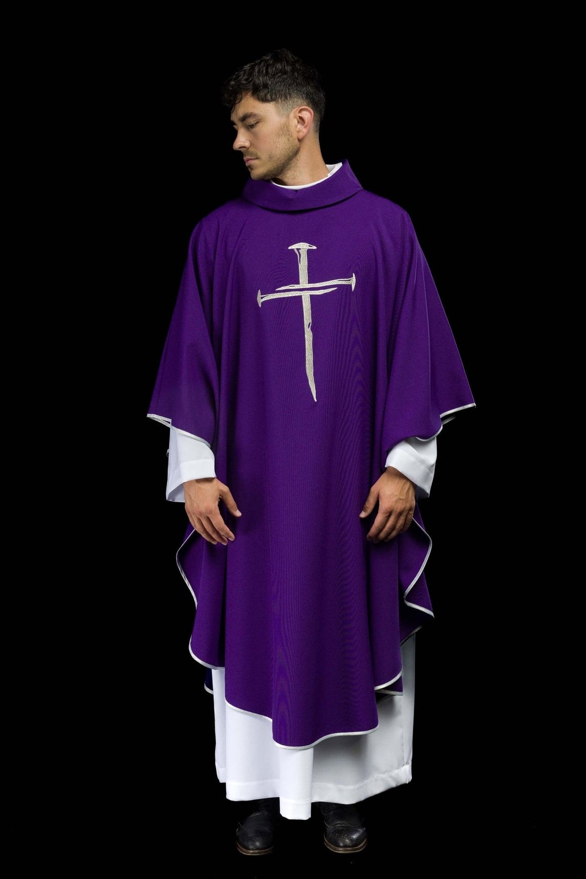 Purple chasuble front view with silver embroidered cross and trim