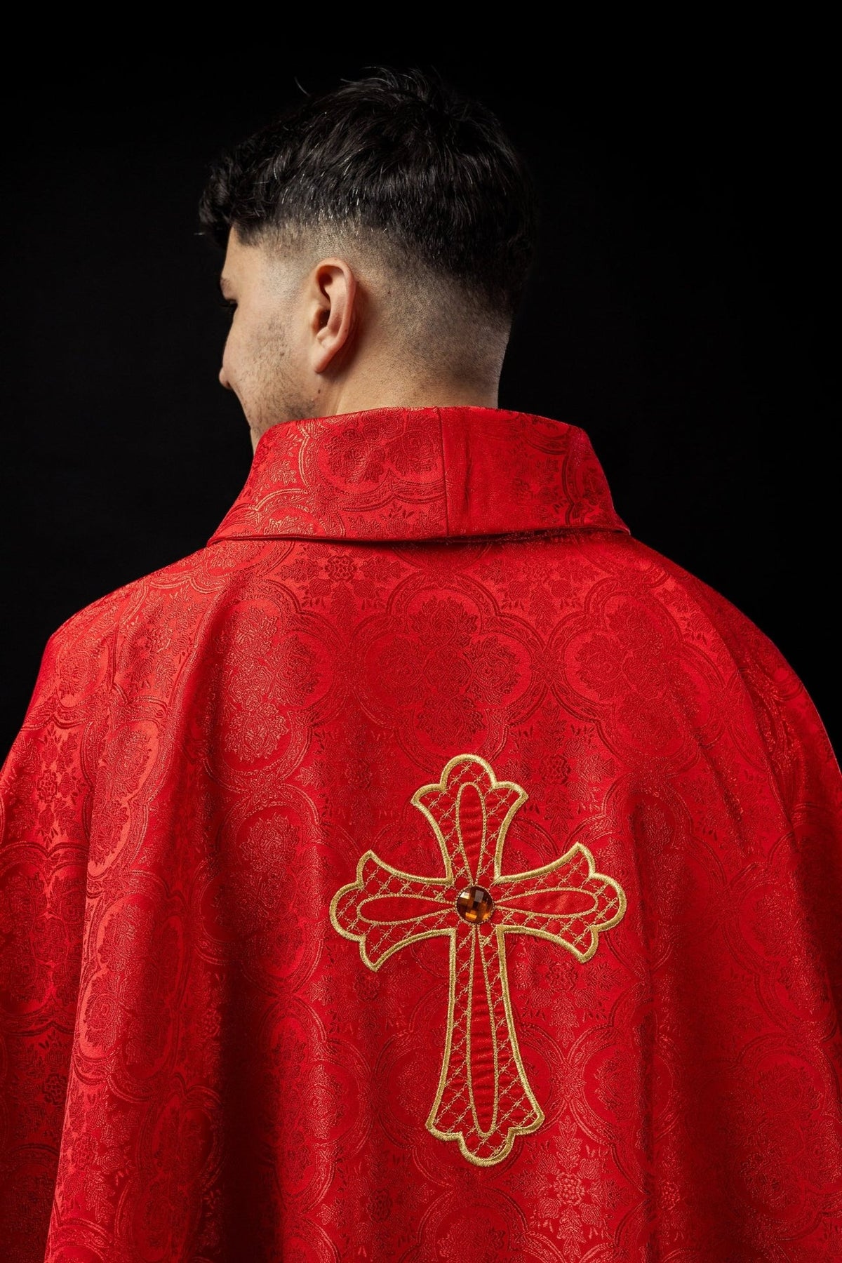 Red chasuble back view with gold embroidered cross and stand-up collar