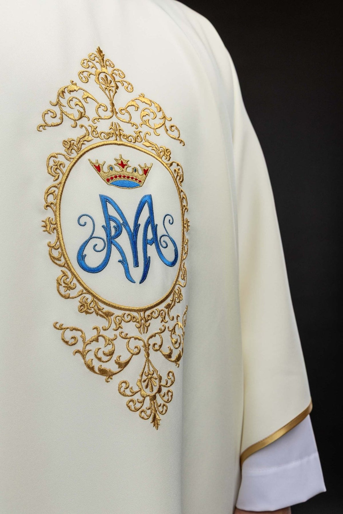 Marian chasuble close-up showing blue Marian motif and surrounding gold embroidery