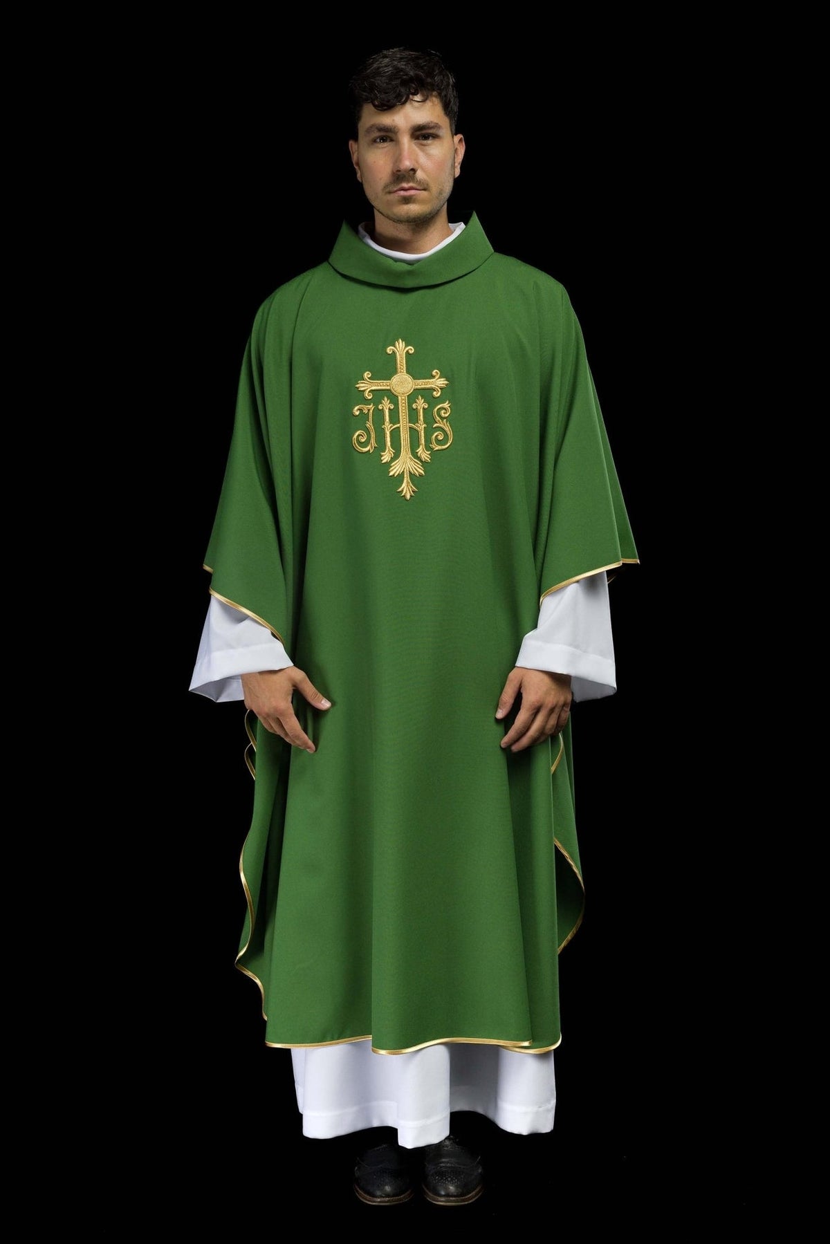 Green chasuble worn full length from the front, with gold JHS embroidery and trim