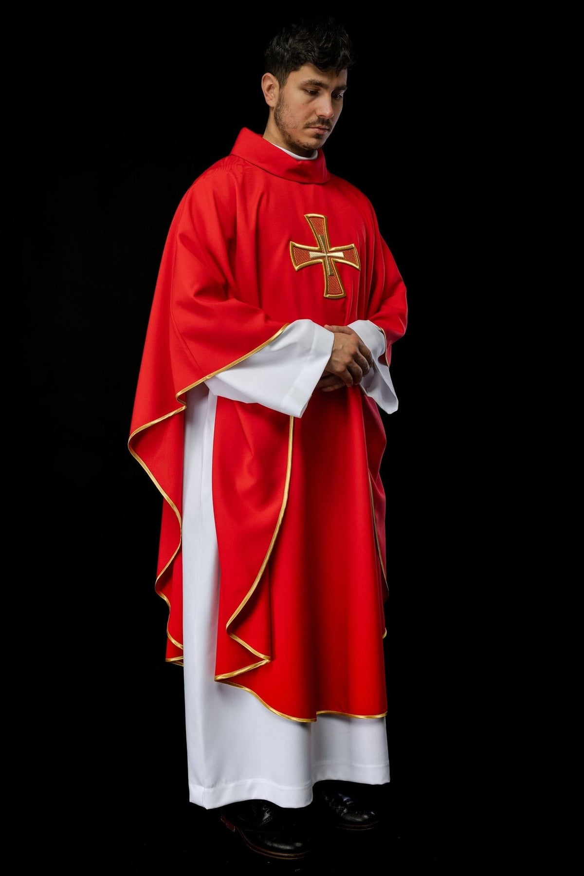 Red chasuble three-quarter view with gold cross embroidery and trim