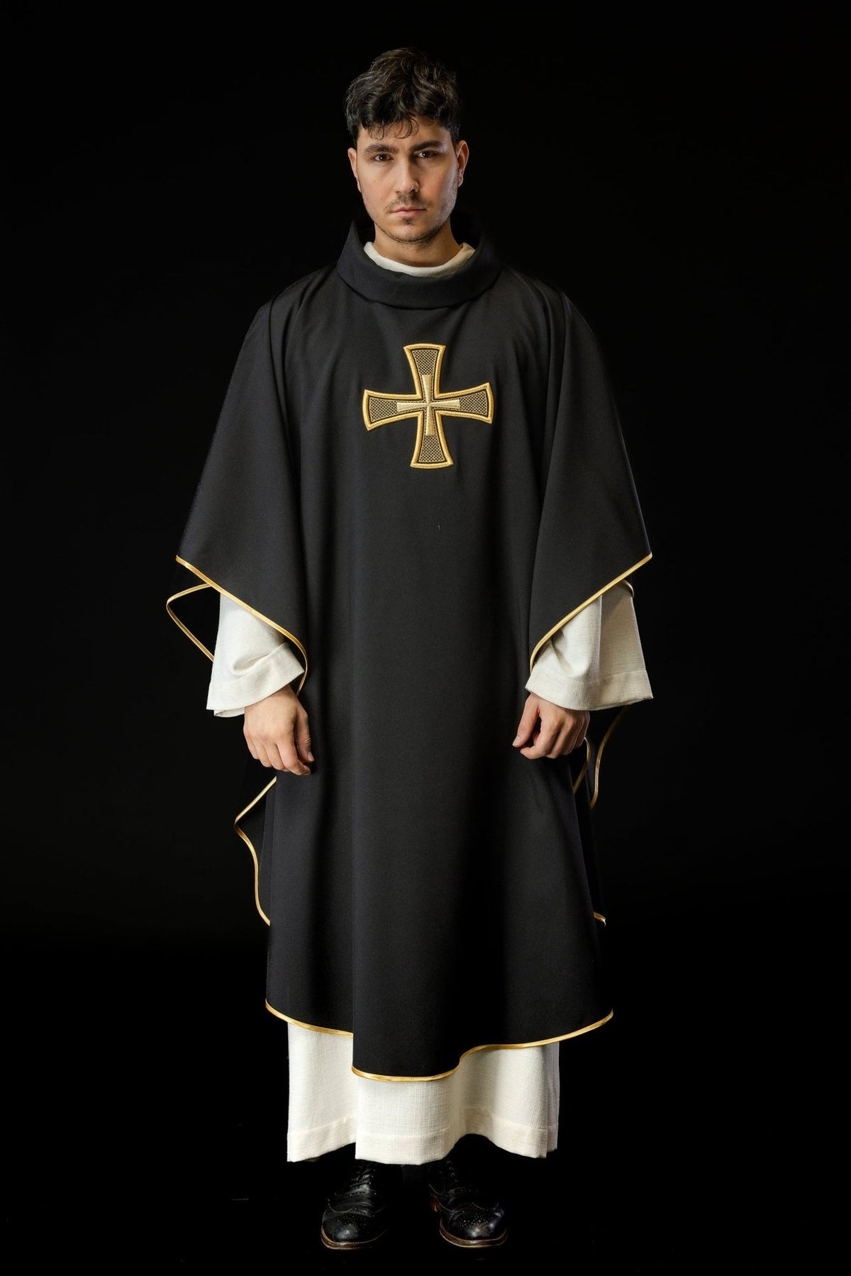Black chasuble with gold cross and gold trim, full front view
