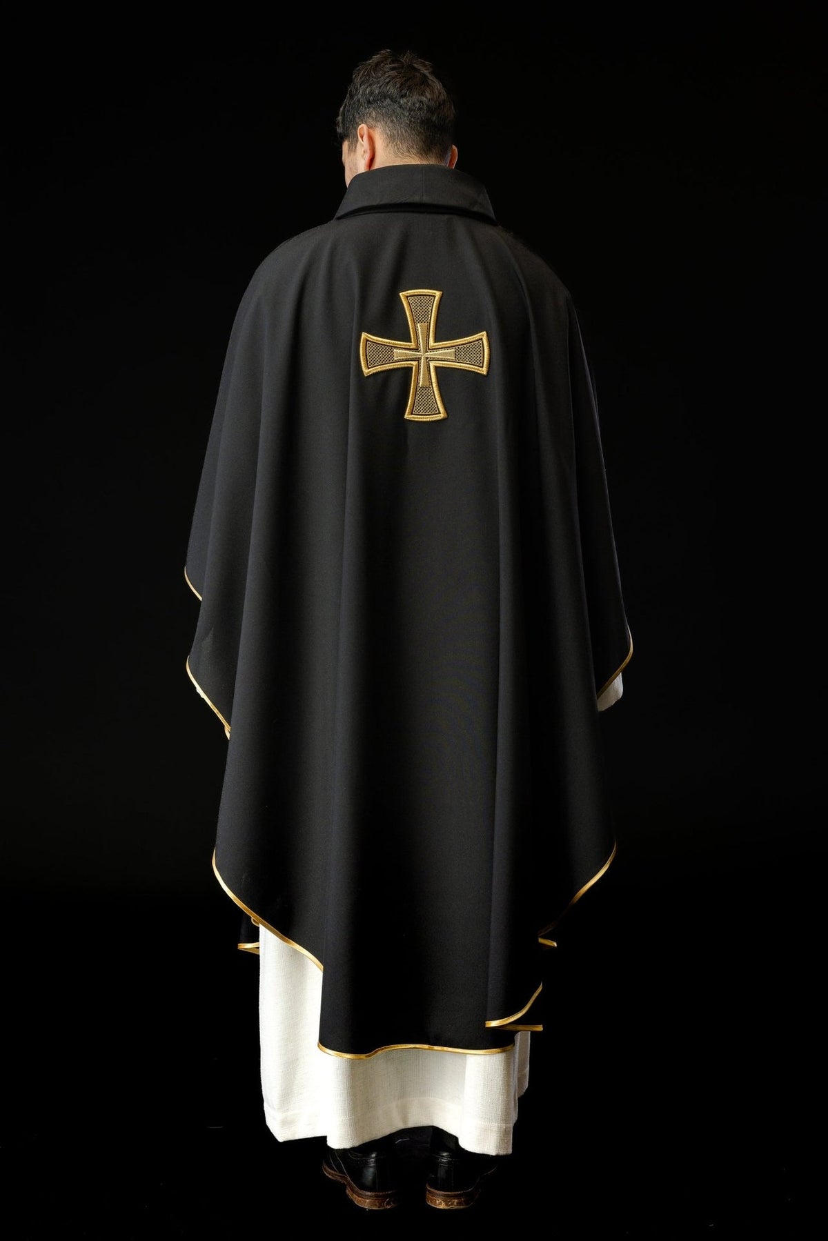 Black chasuble full back view with gold cross and gold trim