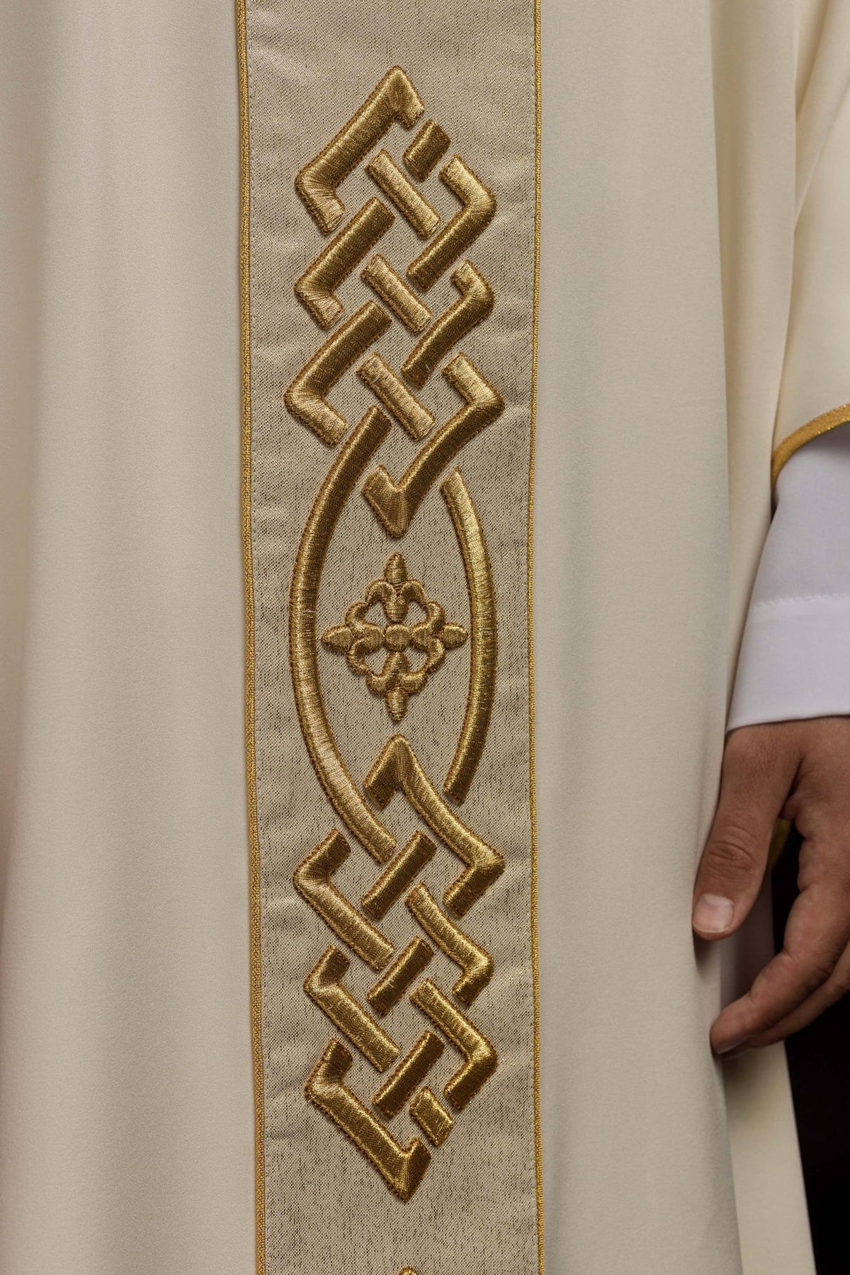 Ecru chasuble close-up of gold embroidery on the central trim