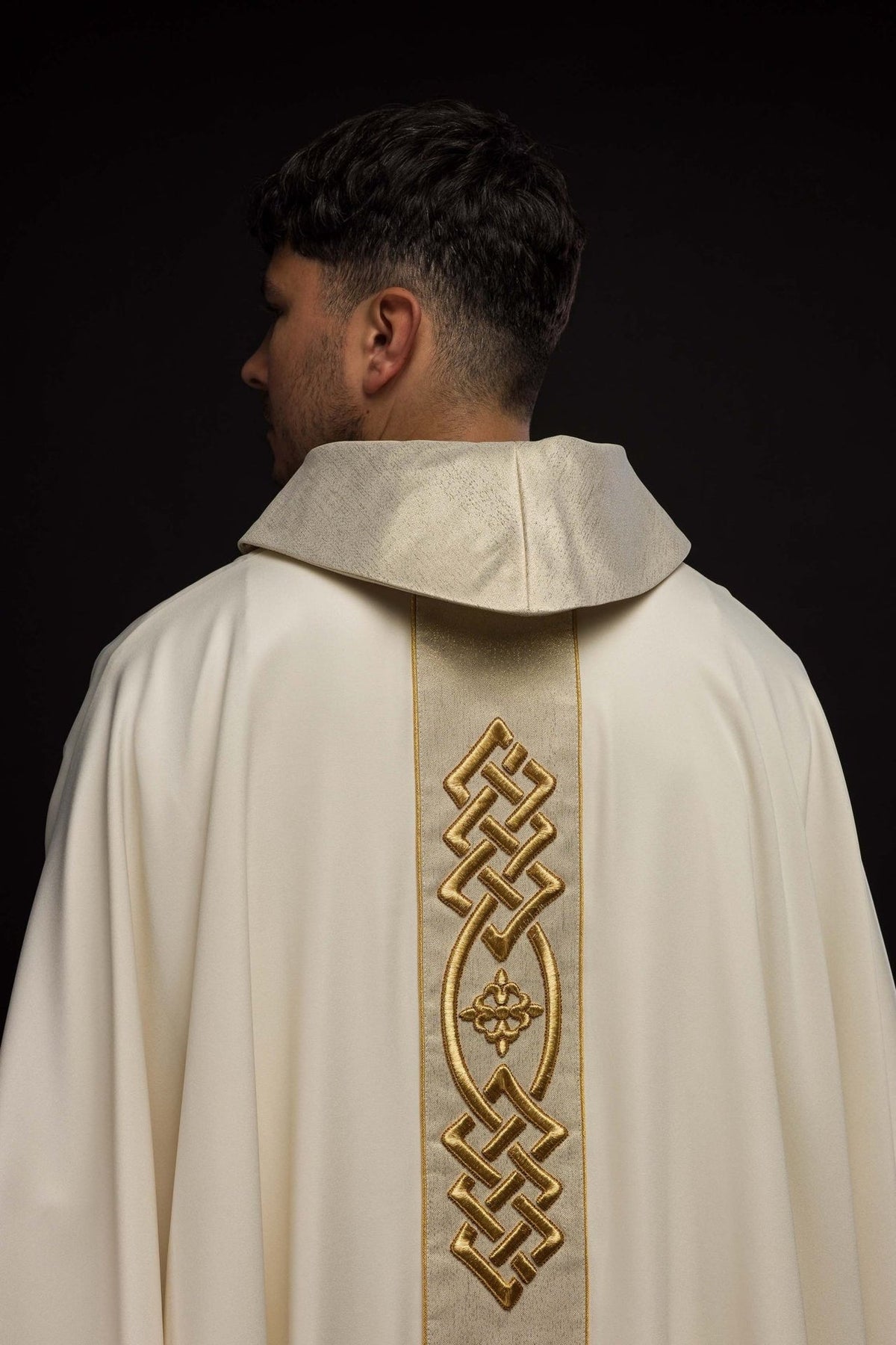Ecru chasuble back view with gold embroidered central trim