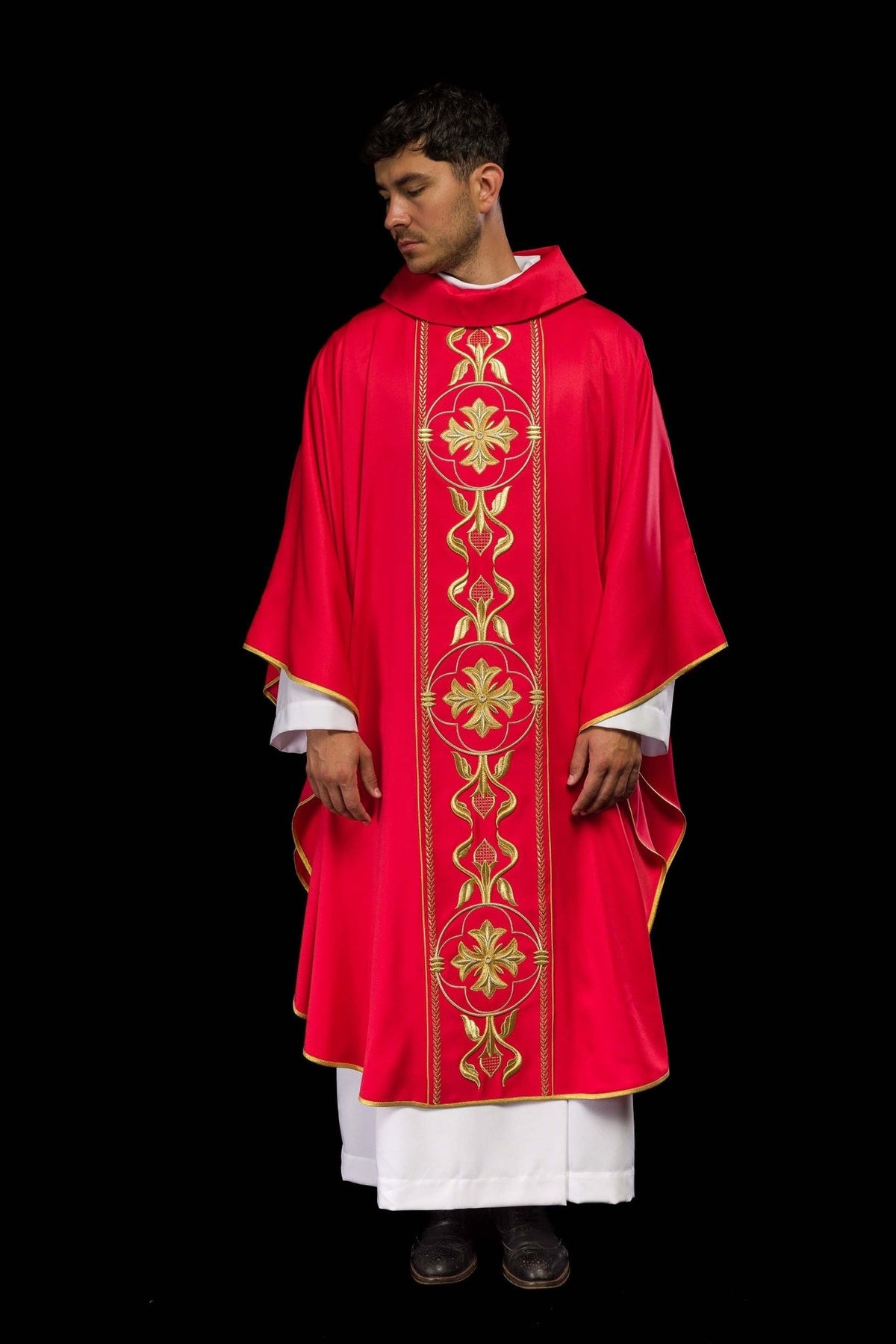 Red chasuble worn in full front view with gold embroidered orphrey