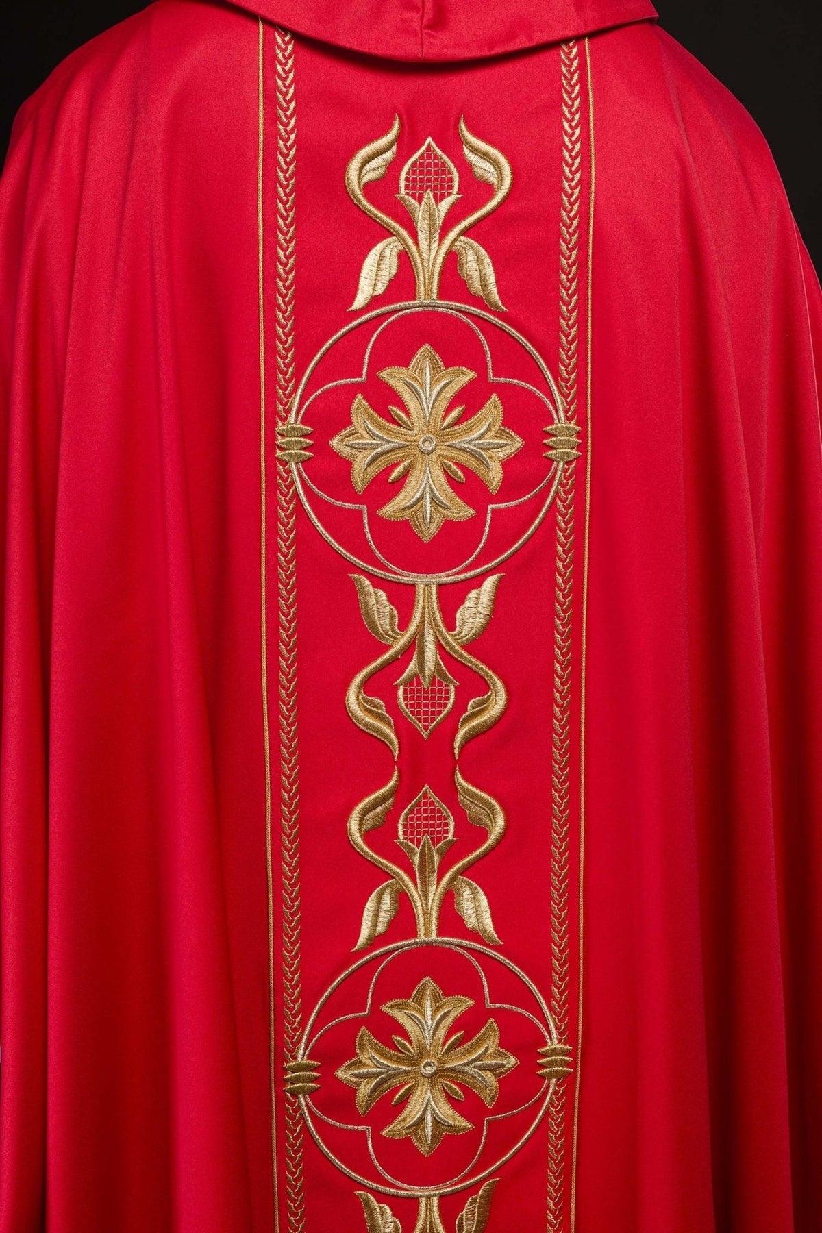 Red chasuble back view with gold embroidered orphrey and trim