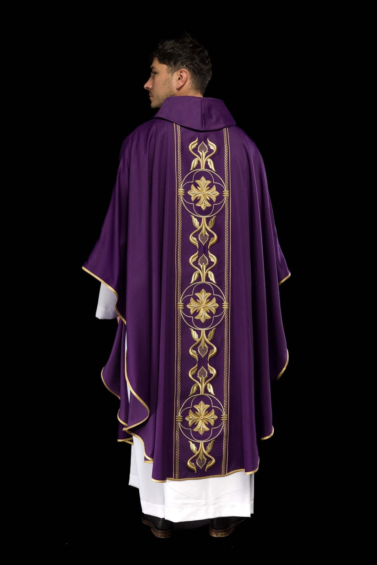 Purple chasuble back view showing gold floral orphrey embroidery and gold trim