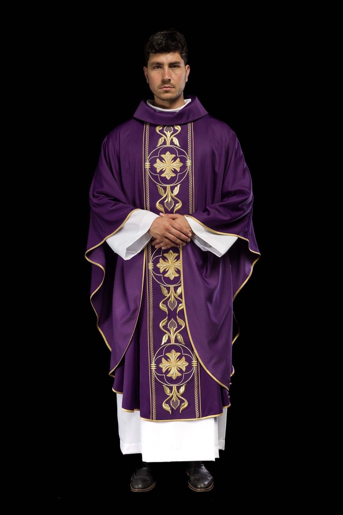Purple chasuble worn front view with gold embroidered orphrey and wide sleeves