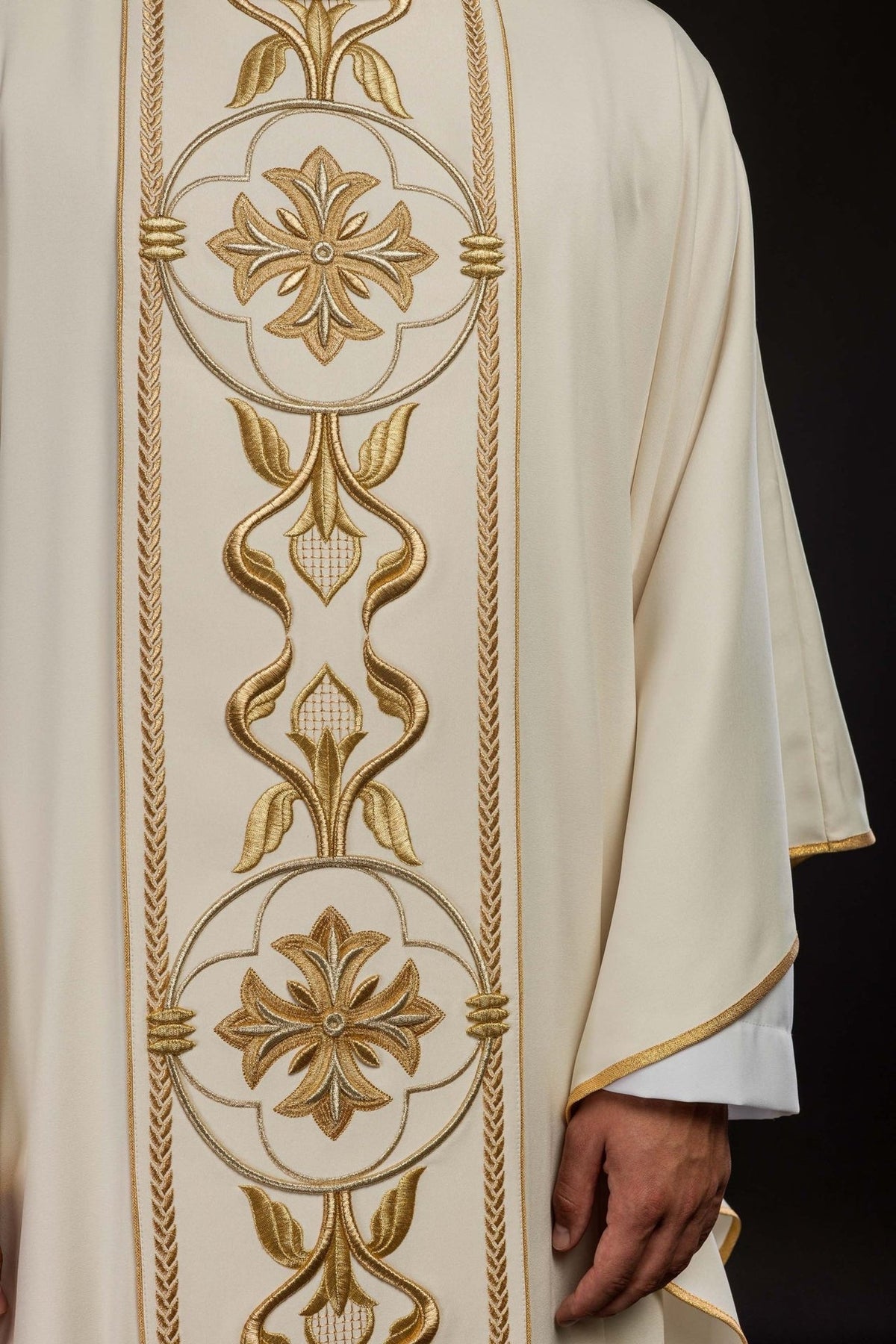 Ecru chasuble front close-up showing gold rosette and floral embroidery