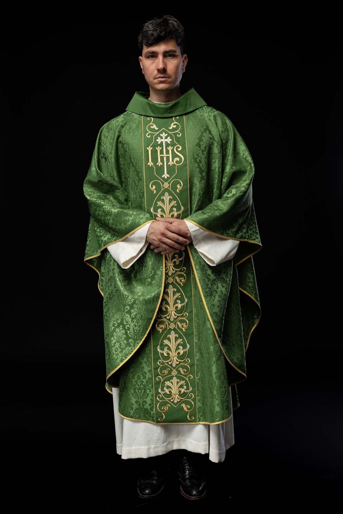 Green chasuble front view worn with full embroidered orphrey and gold trim
