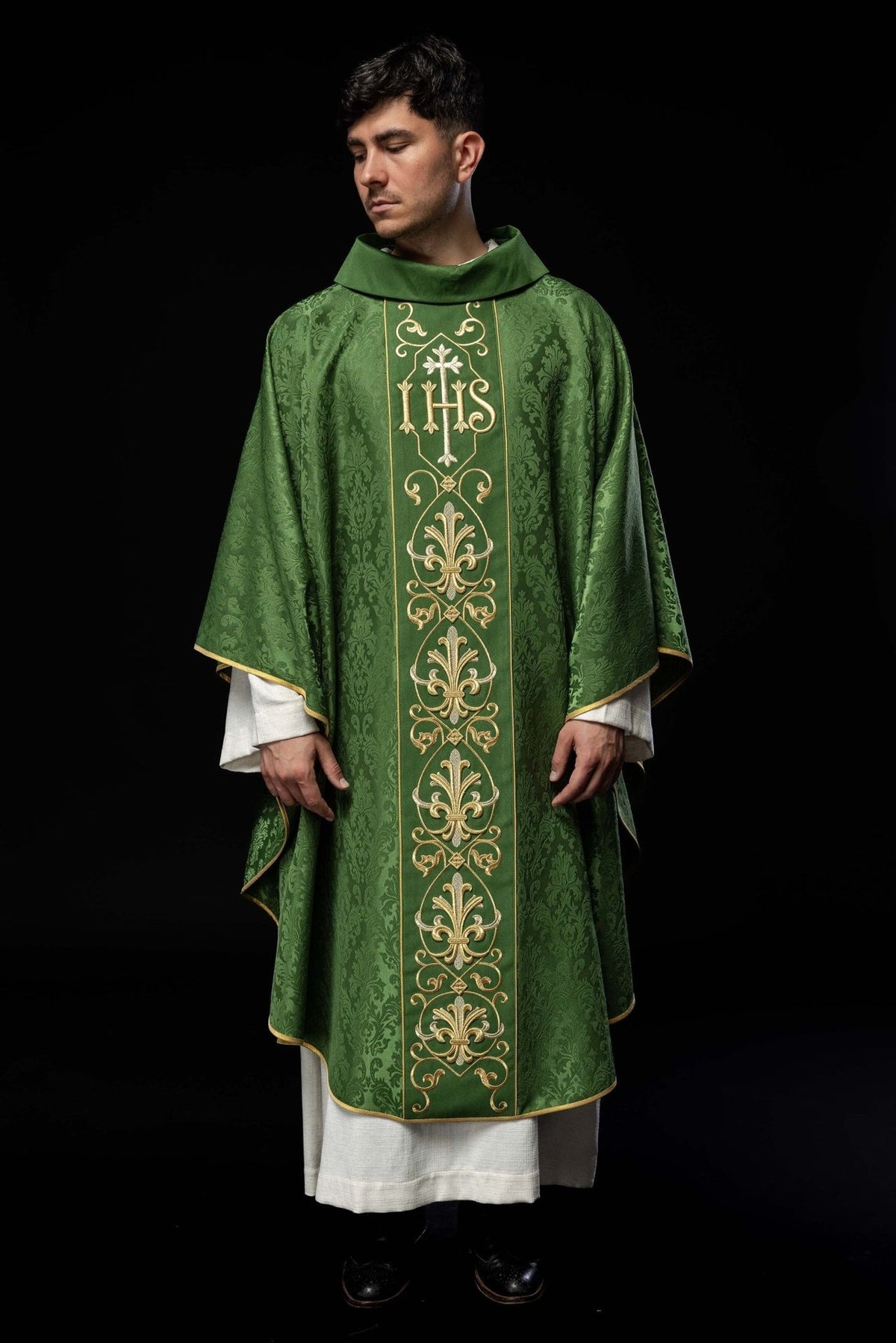 Green chasuble back view with embroidered IHS orphrey and gold trim