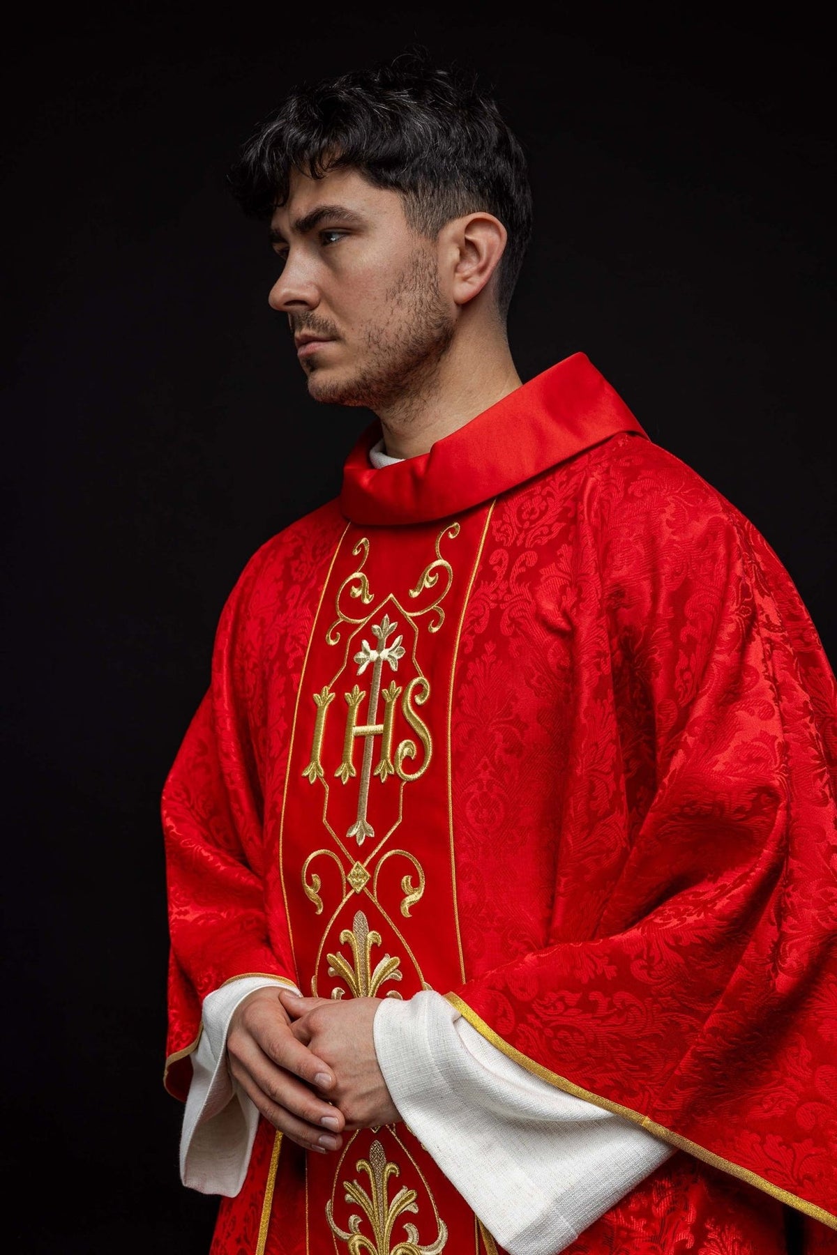 Red chasuble, side view showing the satin stand-up collar and gold trim