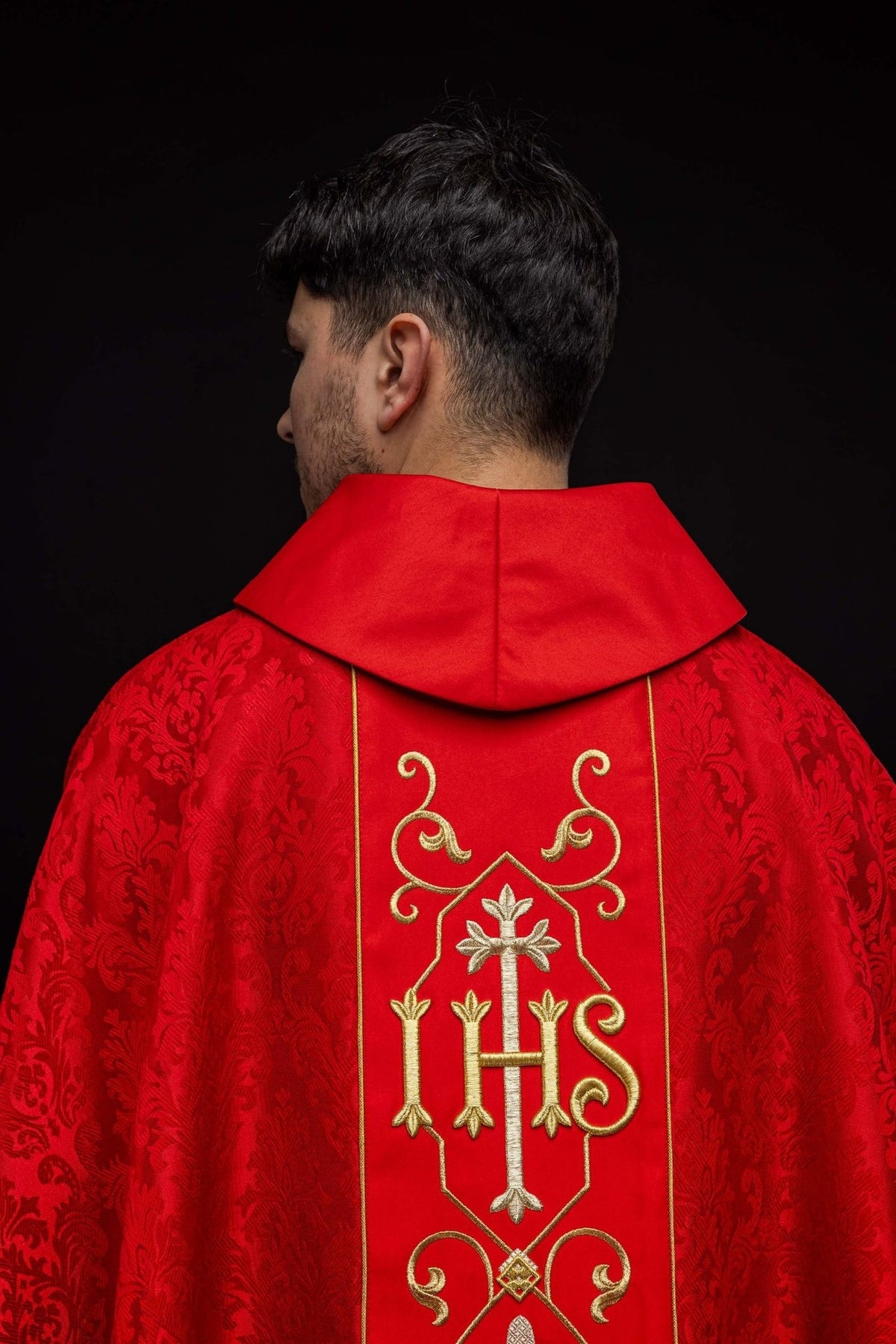 Red chasuble, back close-up with IHS embroidery and patterned fabric