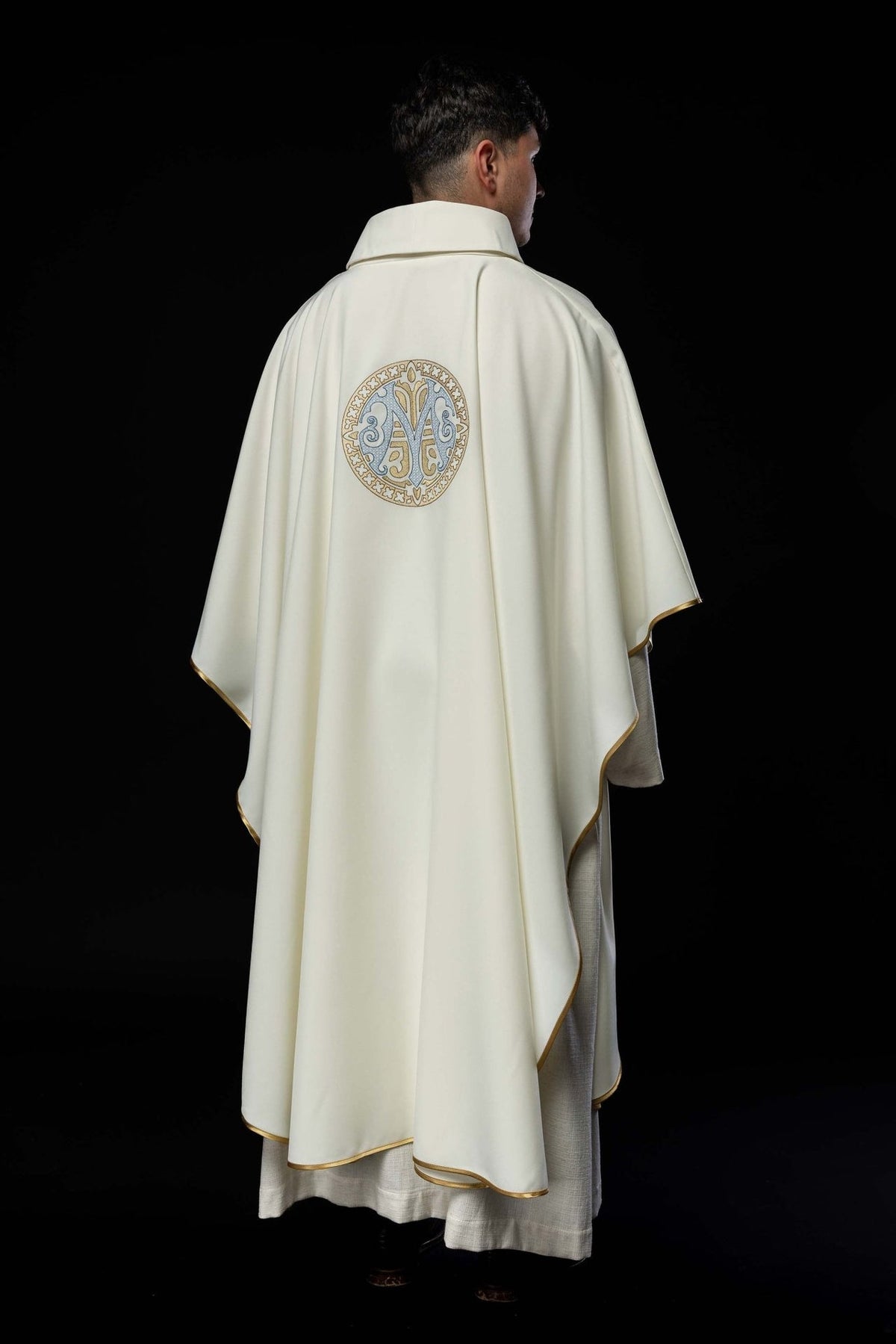 Marian chasuble back worn view with embroidered Marian motif and gold-trimmed edges