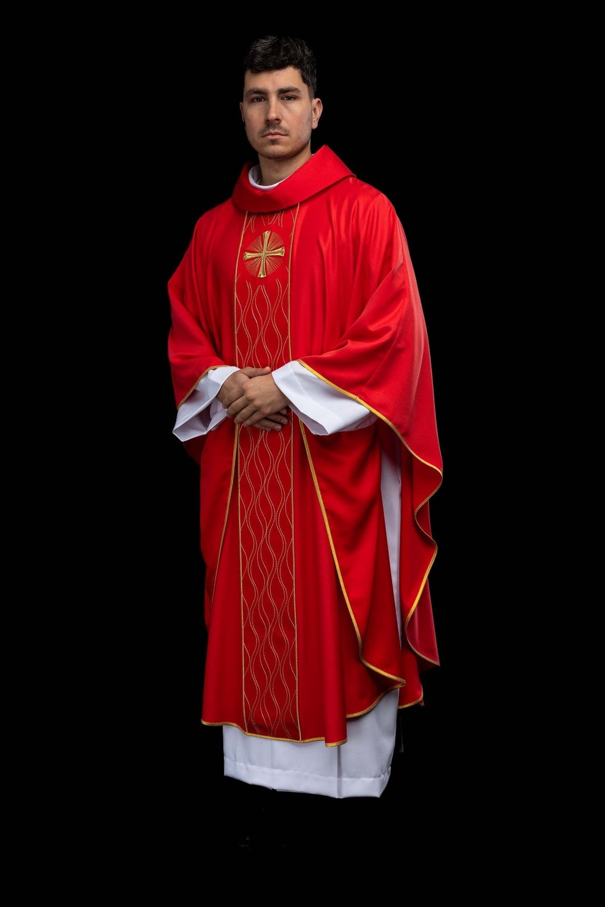 Red chasuble back view with gold cross, wavy orphrey embroidery and trim