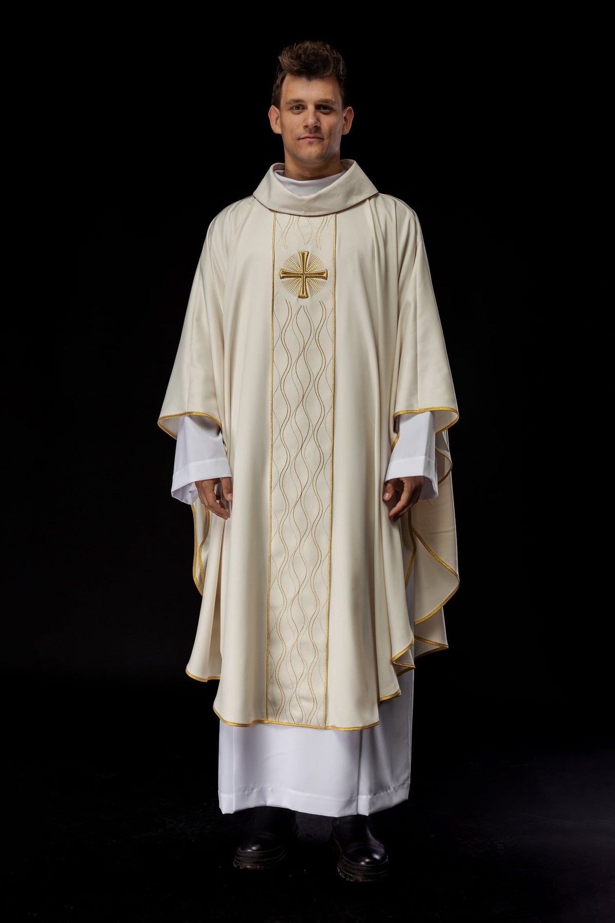 Ecru chasuble worn front view with gold cross embroidery and gold trim