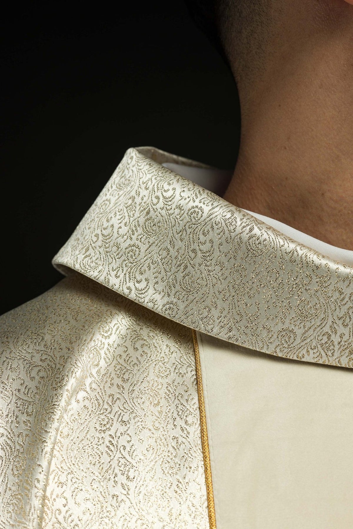 Holy Family chasuble, close-up of sleeve trim and gold cross embroidery