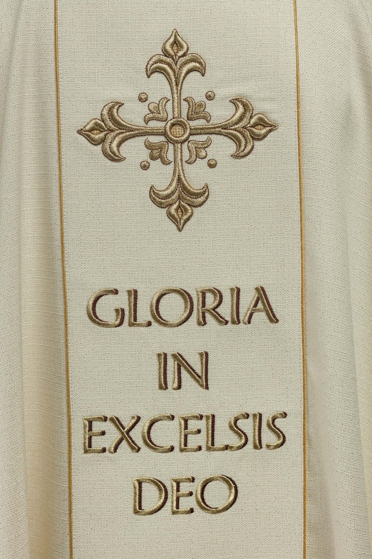 Christmas chasuble back view with embroidered cross, lettering and gold orphrey