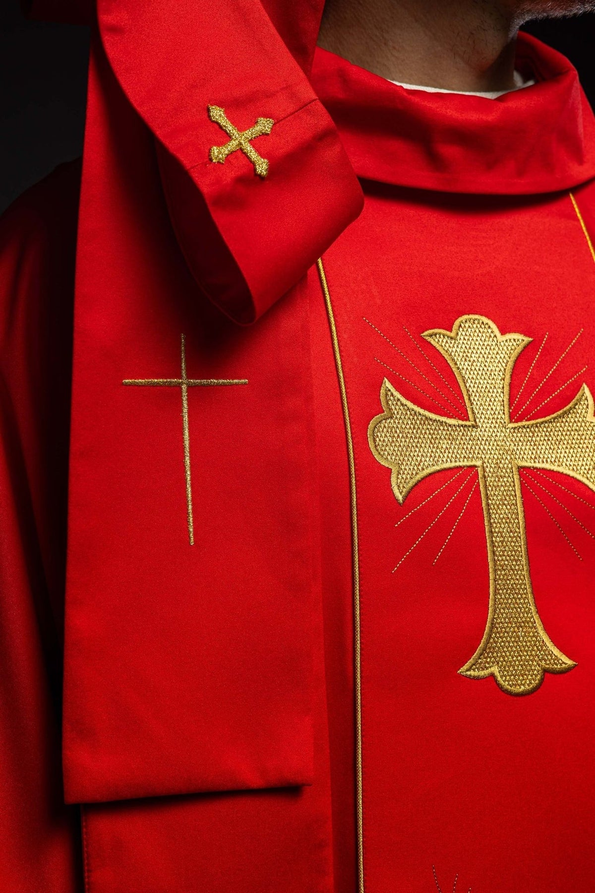 Red chasuble close-up of gold wheat and floral embroidery