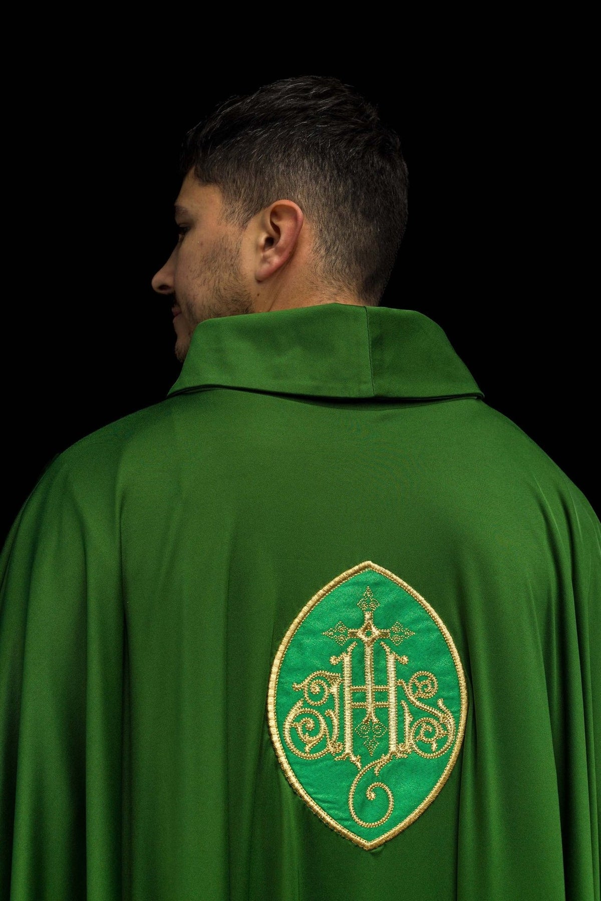 Green embroidered chasuble, back view with gold cross motif