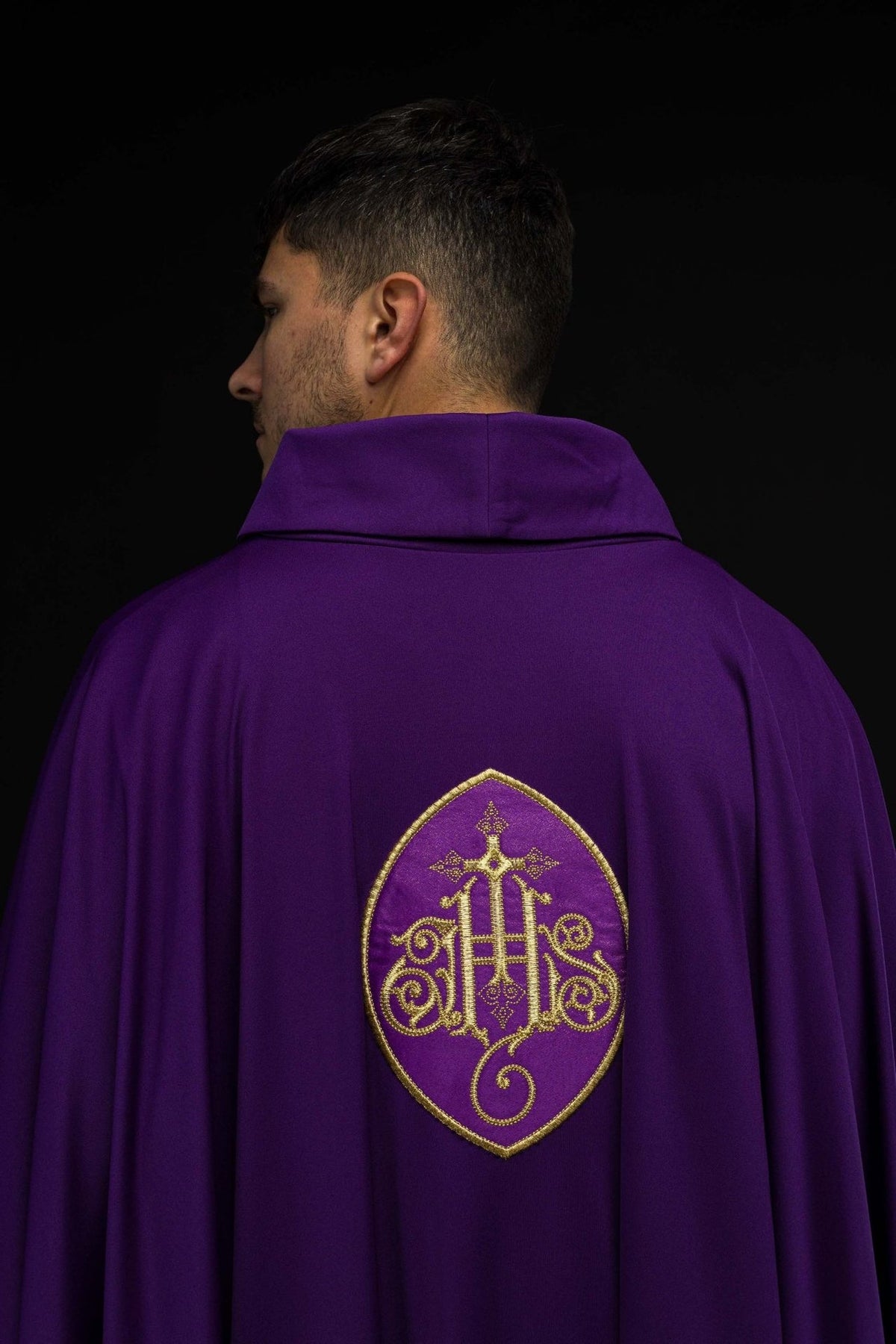 Purple chasuble back view with gold IHS embroidery
