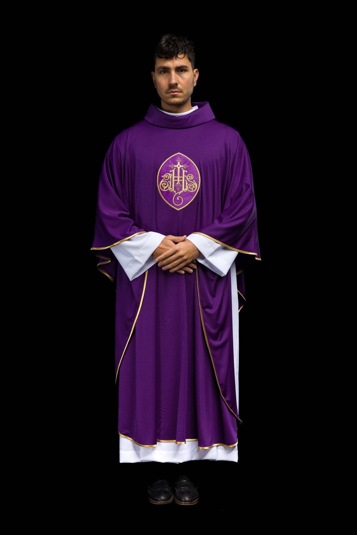 Purple chasuble front view with gold embroidery and white cuffs