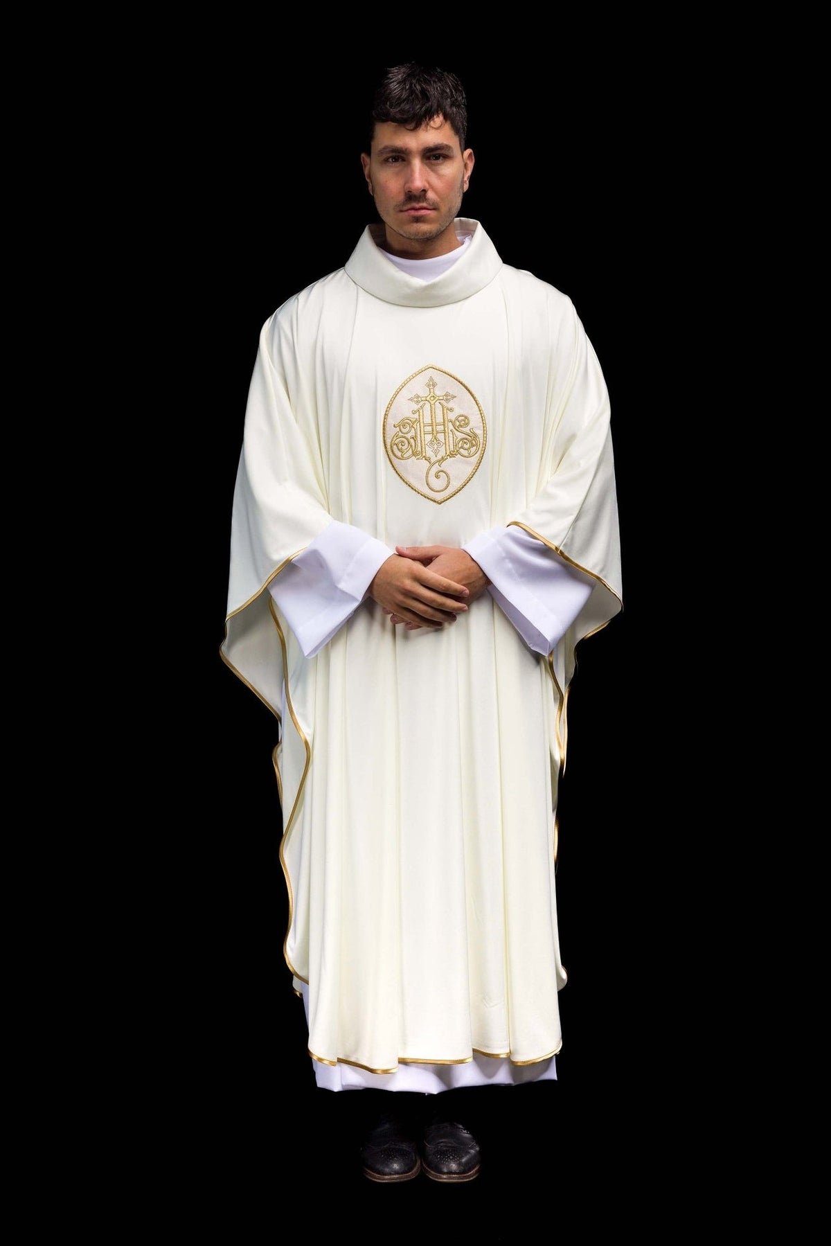 SACROLITE knit chasuble, full front view in ecru with gold trim and IHS embroidery