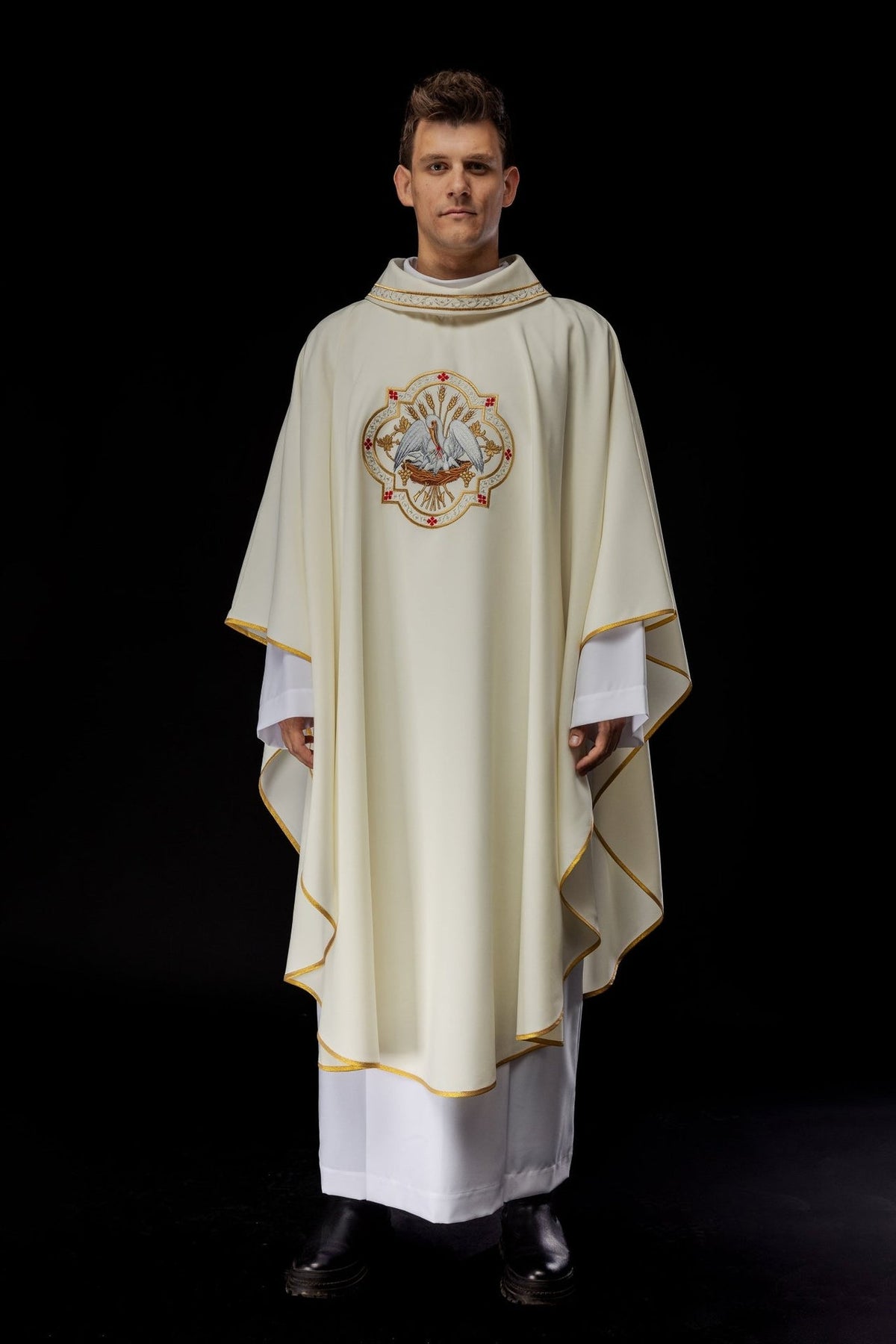 Ecru chasuble, full front view with embroidered pelican motif and gold trim