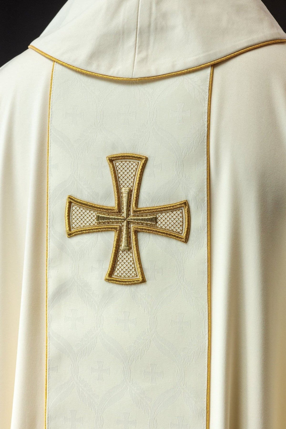 Catholic chasuble back close-up showing embroidered cross on the orphrey