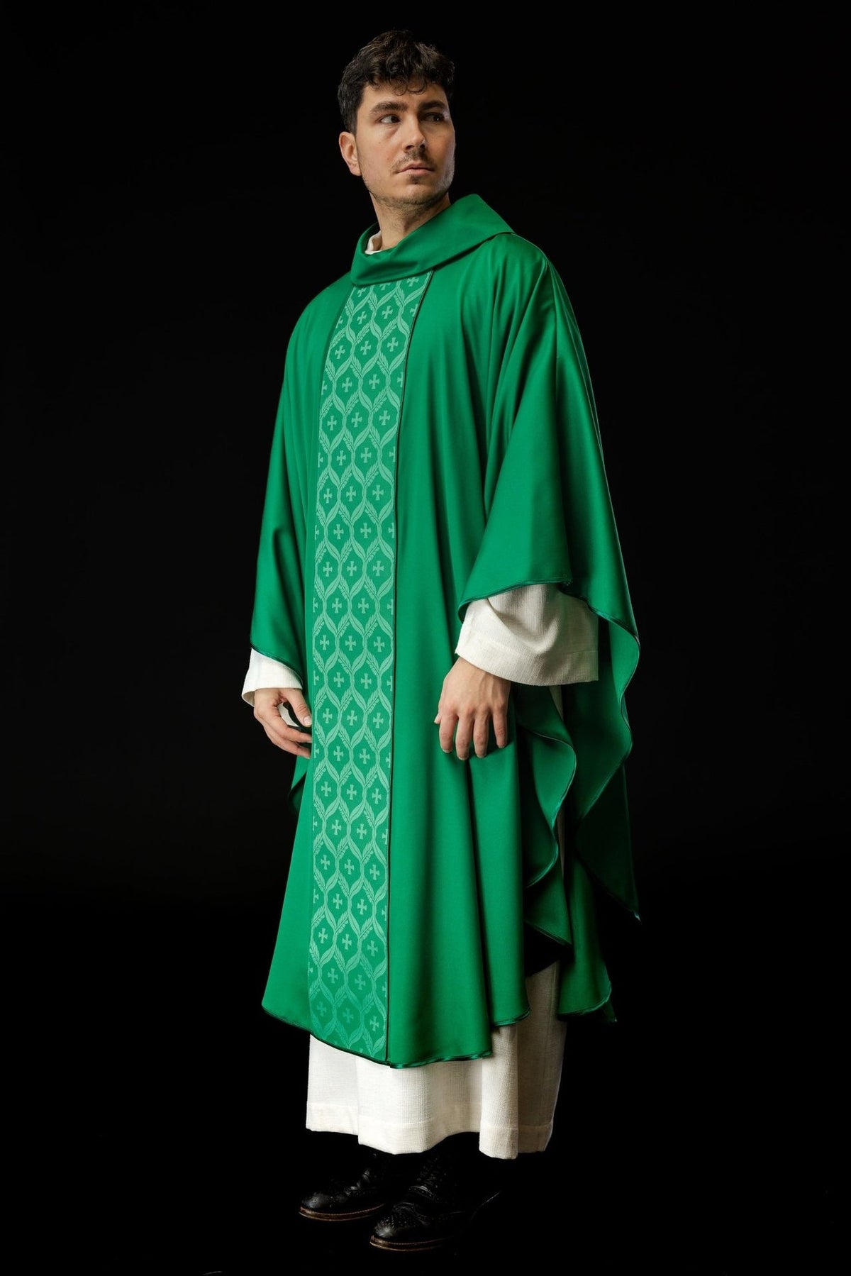 Green chasuble, angled front view with jacquard orphrey and cross pattern