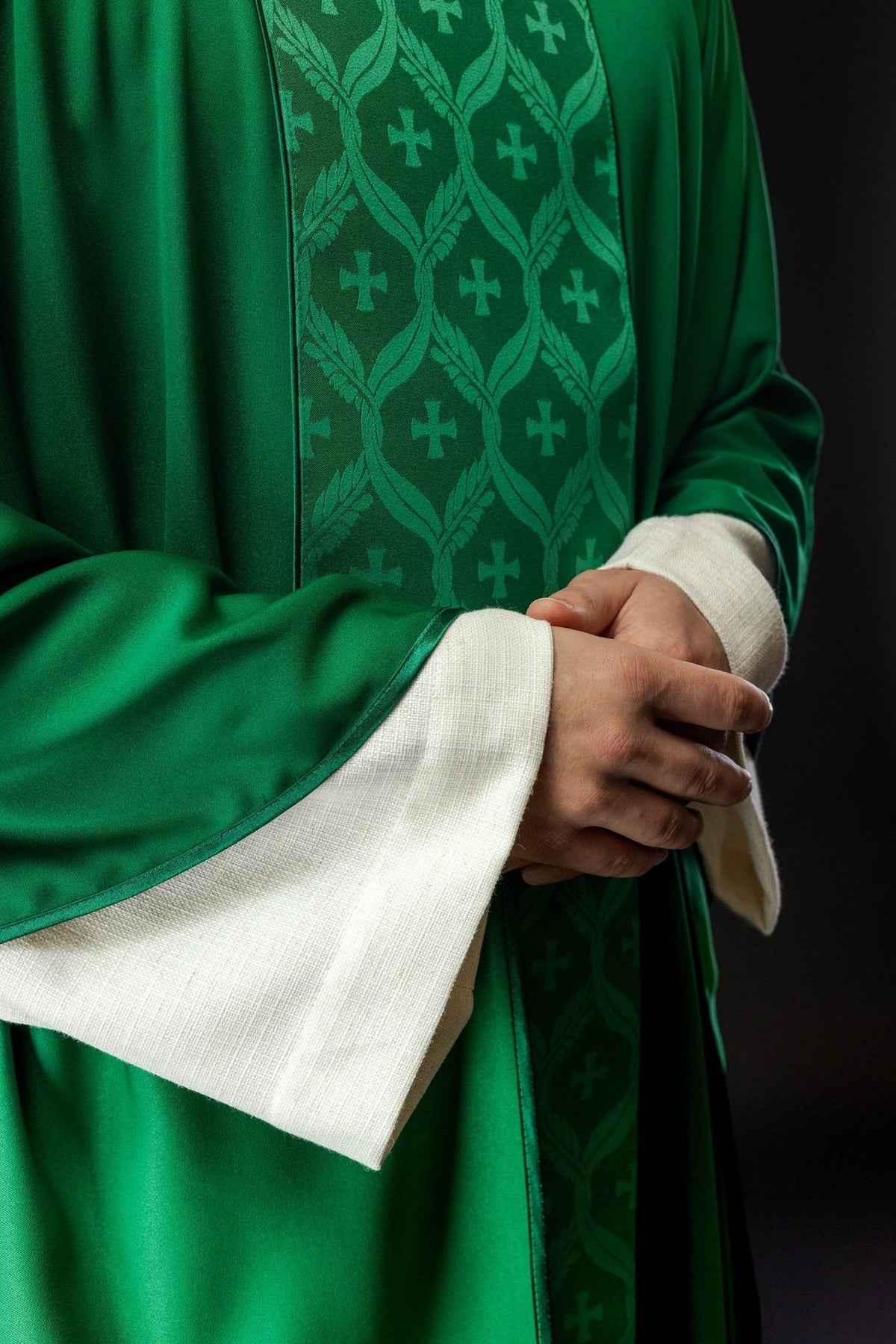 Green chasuble close-up of jacquard orphrey and satin trim