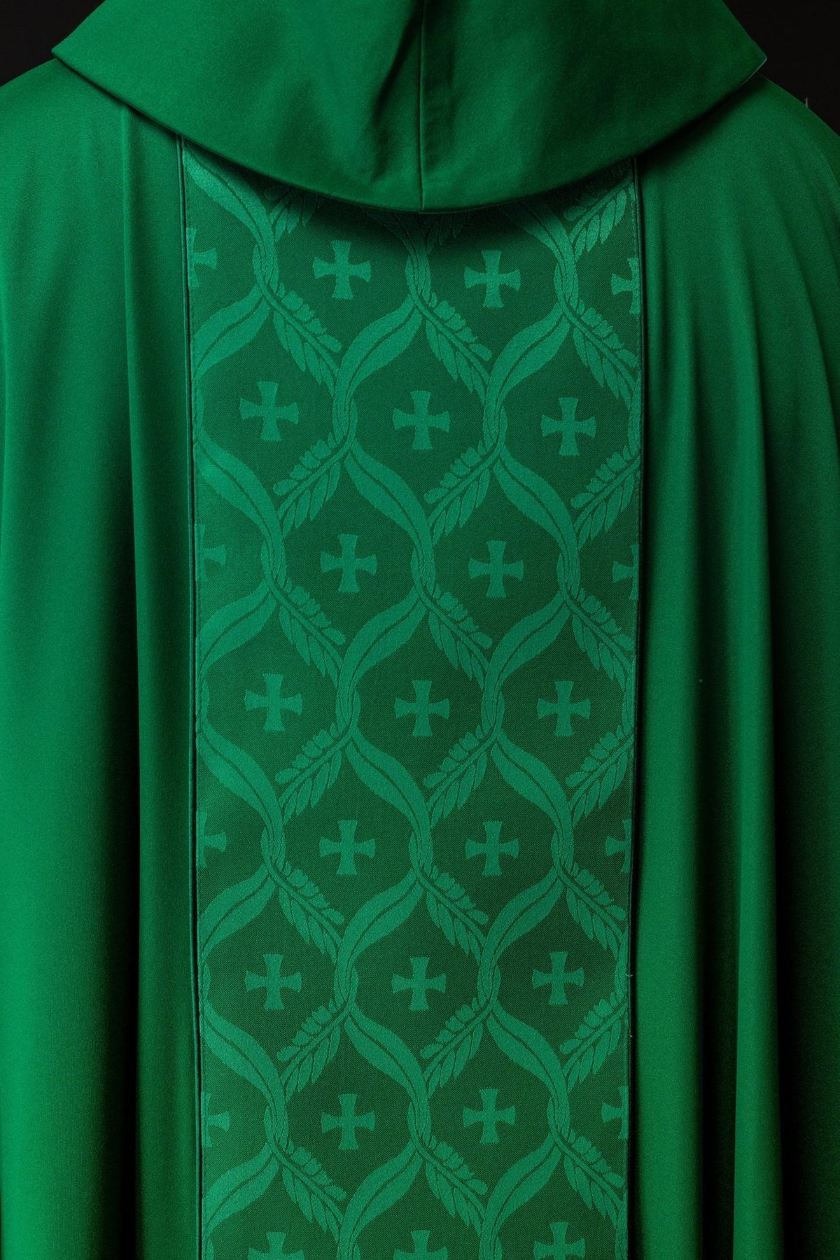 Green chasuble back detail with jacquard orphrey and repeated crosses
