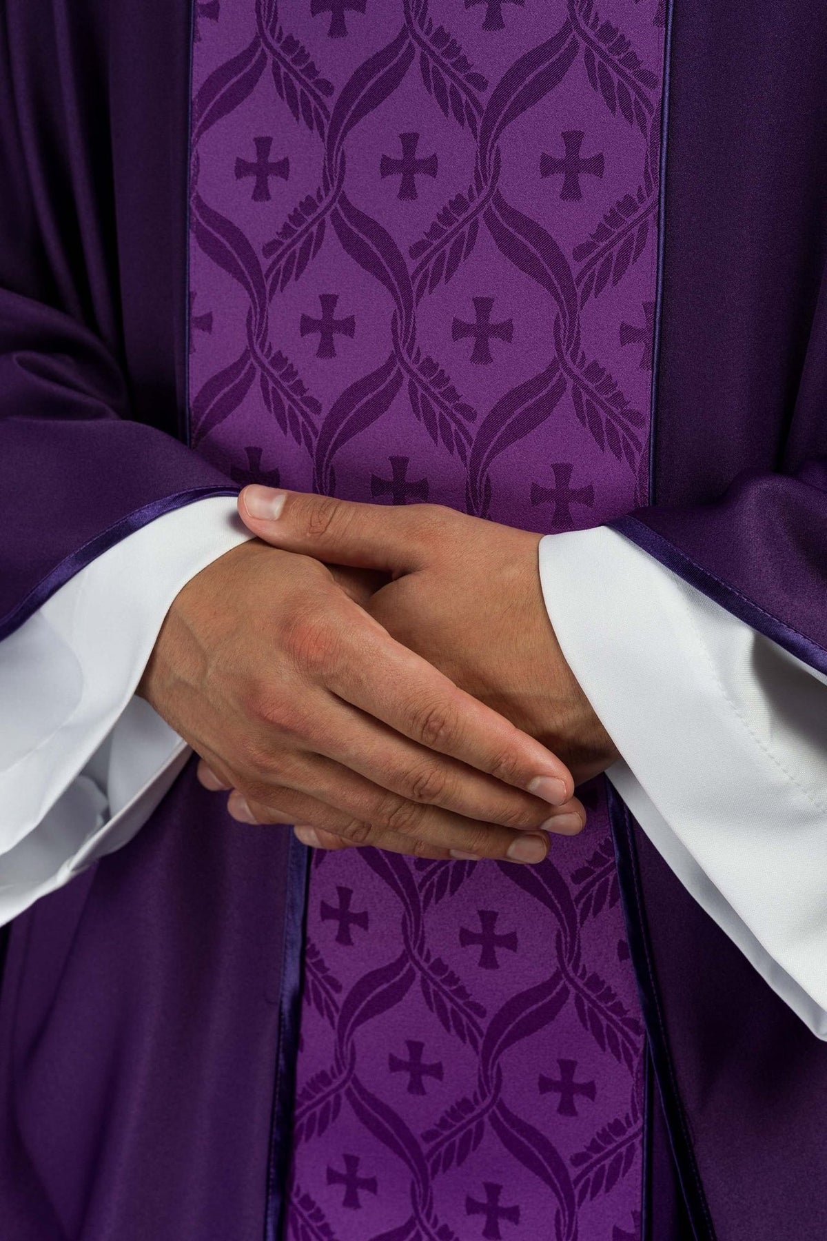 Purple chasuble front detail showing jacquard orphrey and crosses