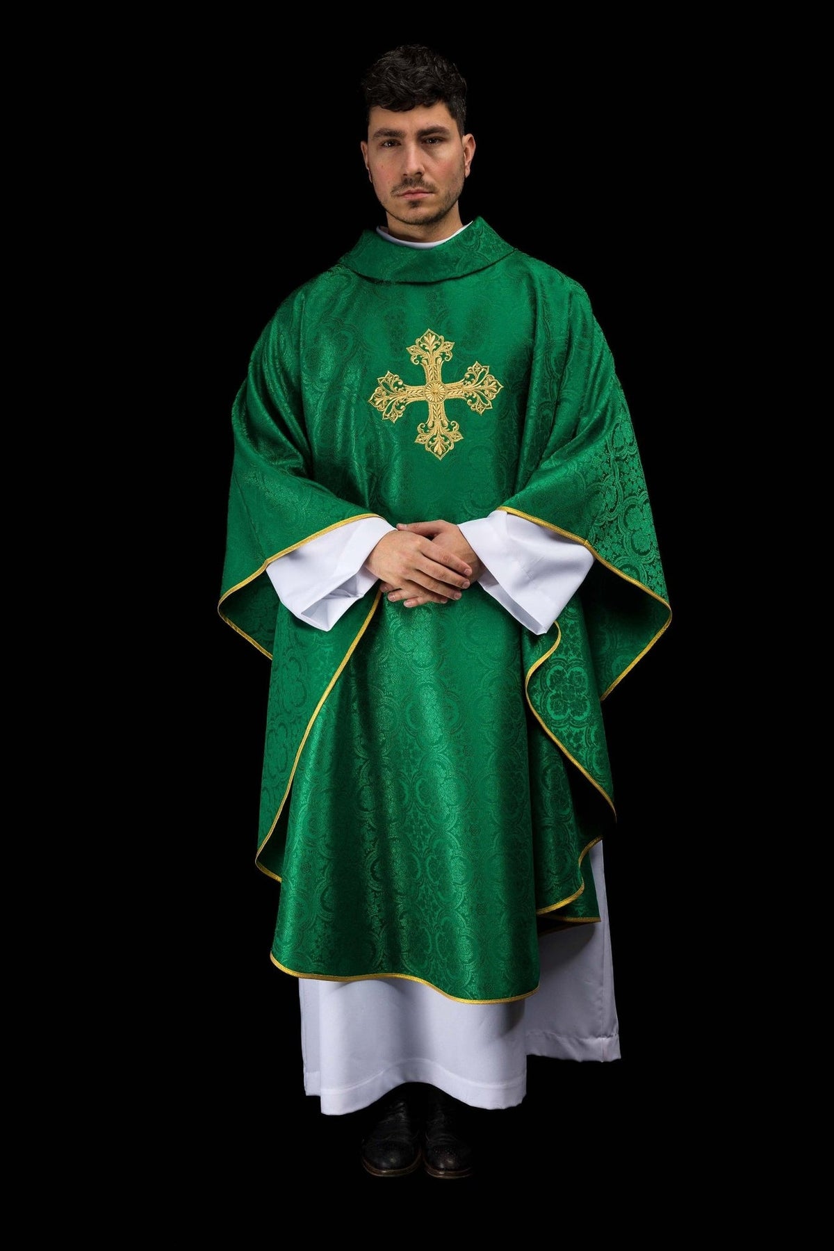 Green chasuble worn from the front, showing gold cross and gold trim