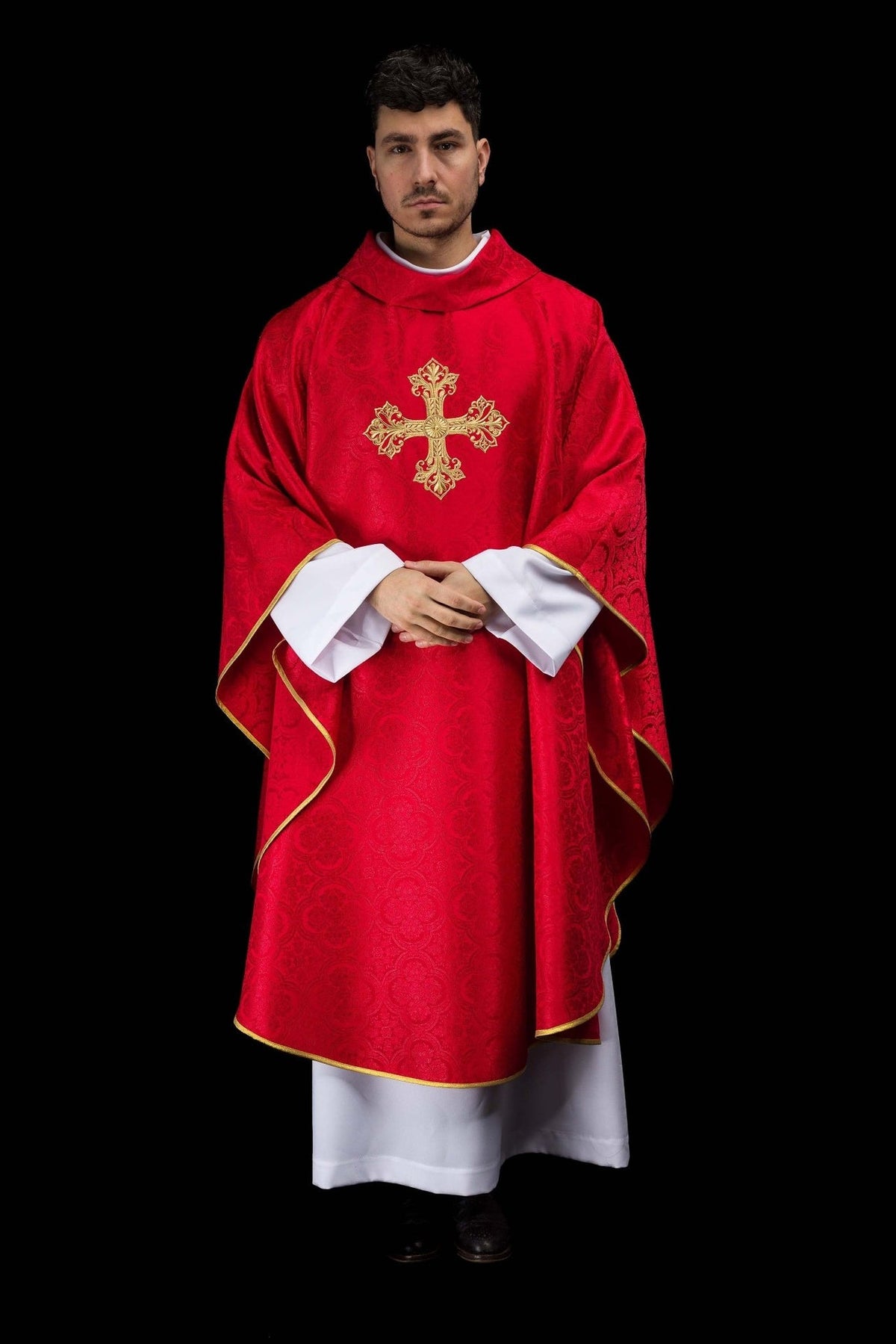 Red chasuble front view with gold embroidered cross and gold trim