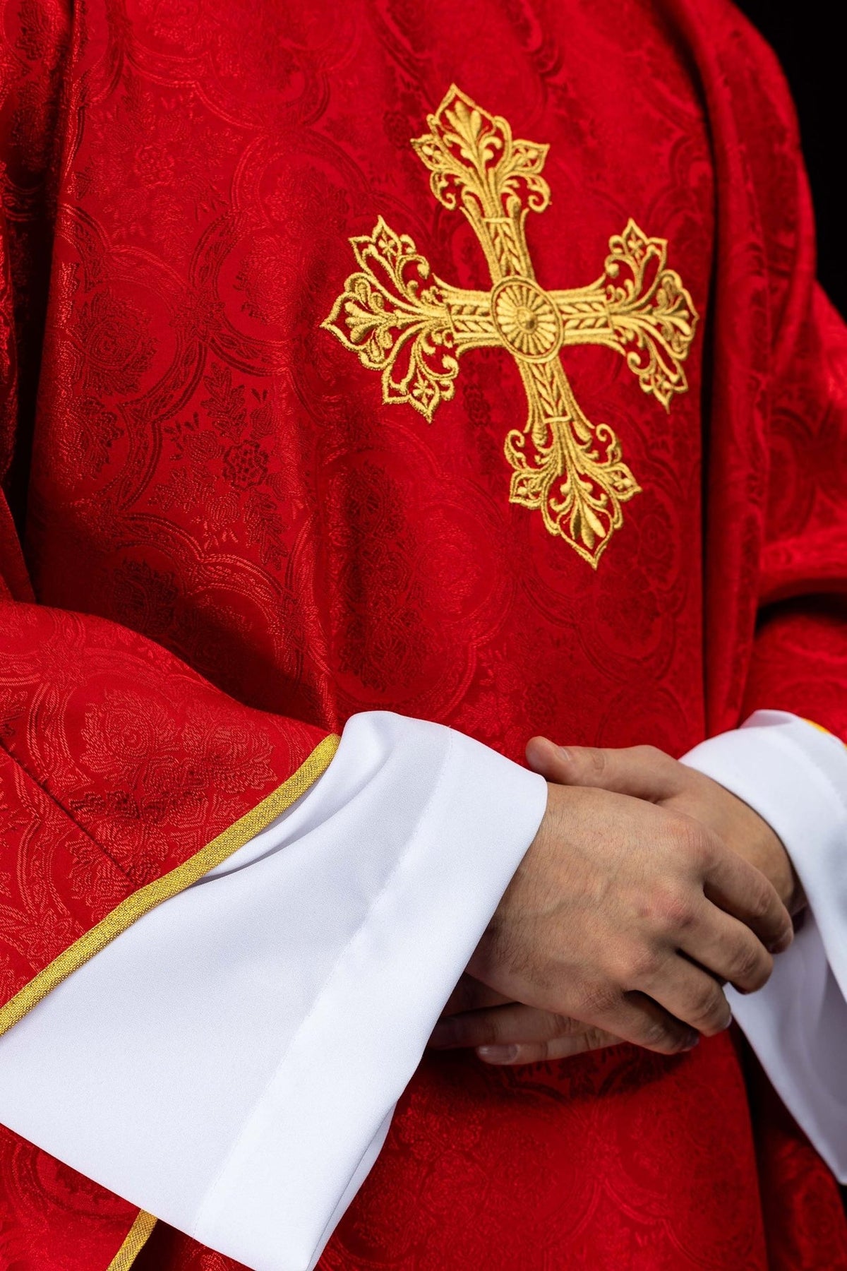 Red chasuble front detail with gold cross embroidery and jacquard fabric
