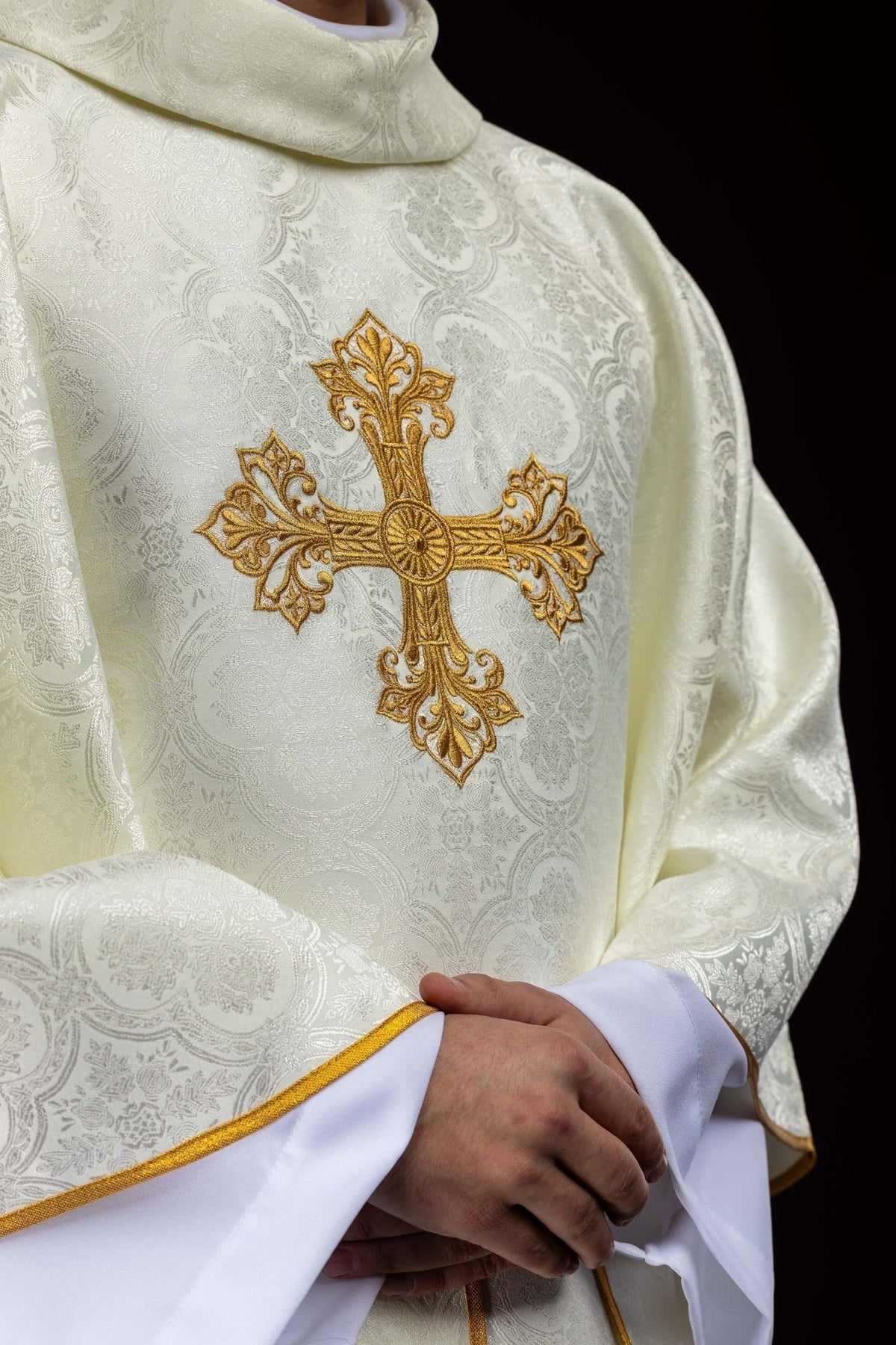 Ecru chasuble front detail with gold cross embroidery and jacquard fabric