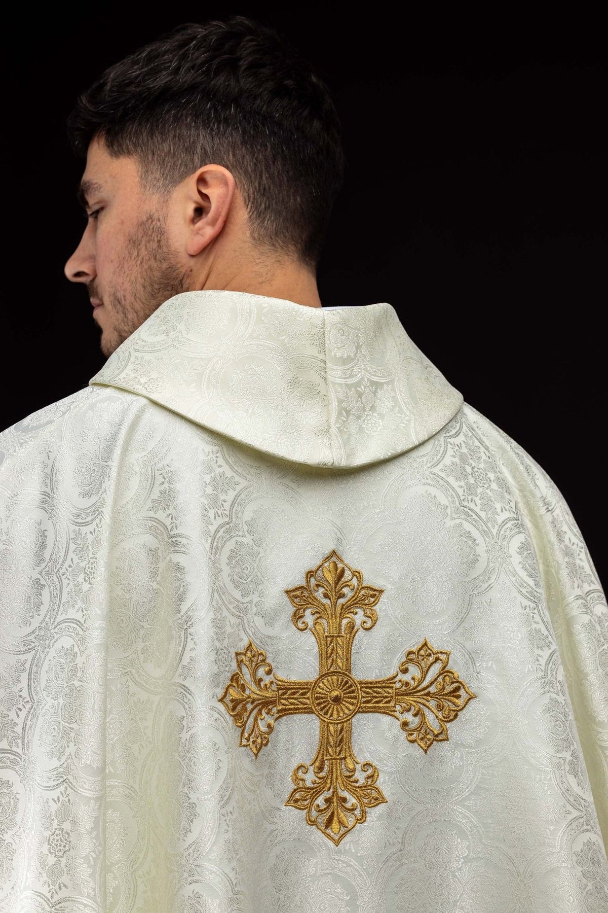 Ecru chasuble back view with gold embroidered cross and stand-up collar