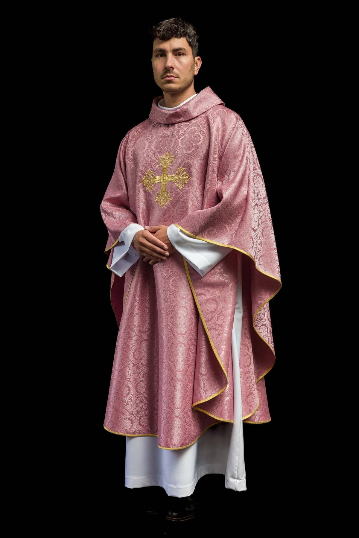 Rose chasuble side view with patterned fabric, gold trim and front cross embroidery