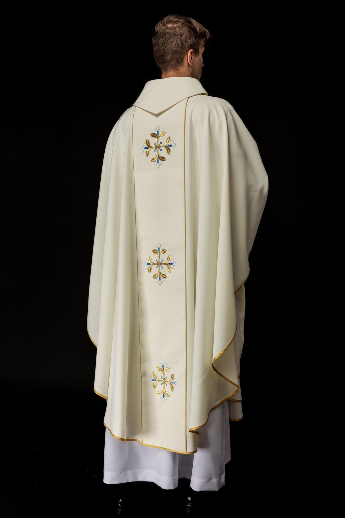 Chasuble back view showing stand-up collar and repeated cross embroidery