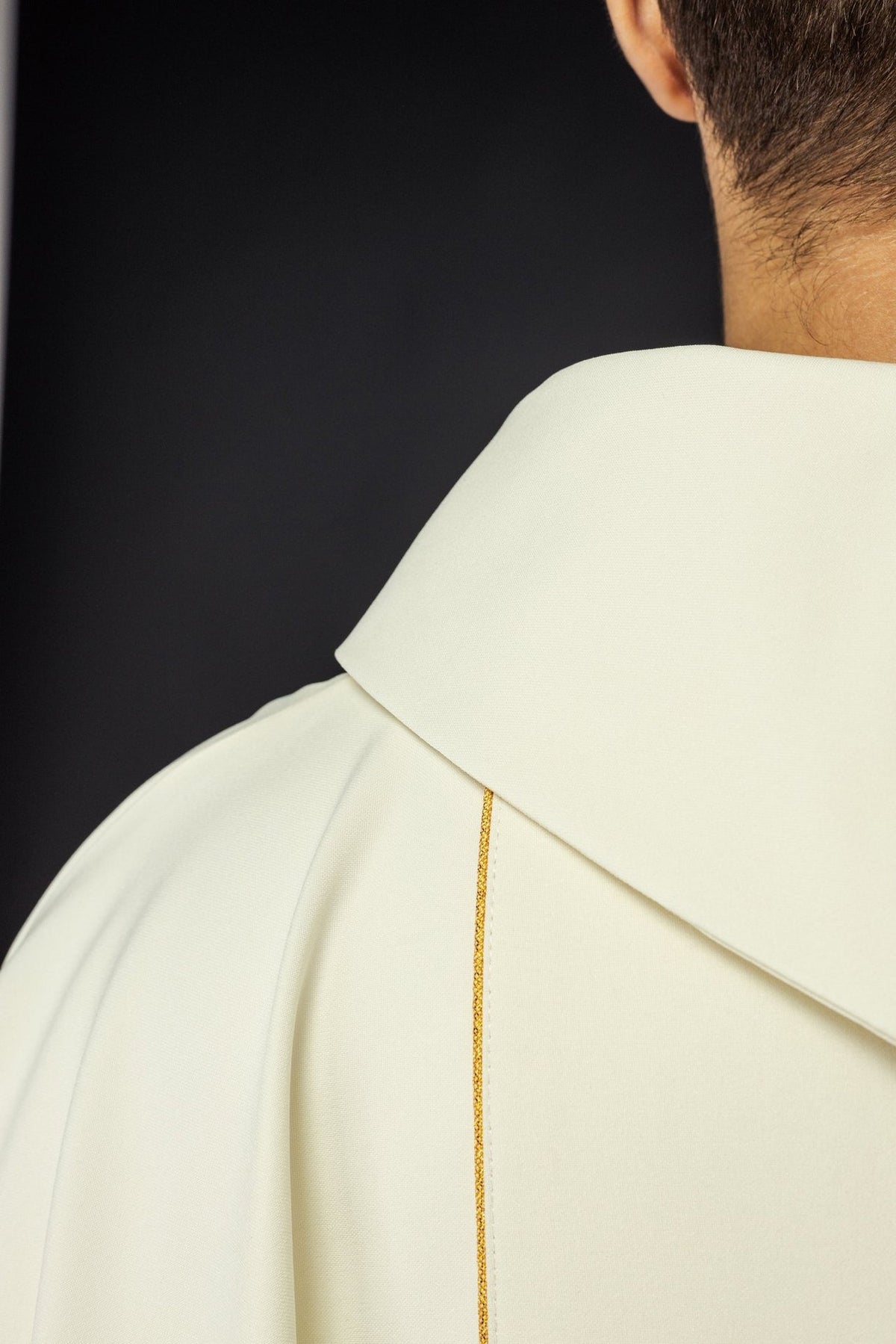 Ivory chasuble close-up showing stand-up collar and gold trim