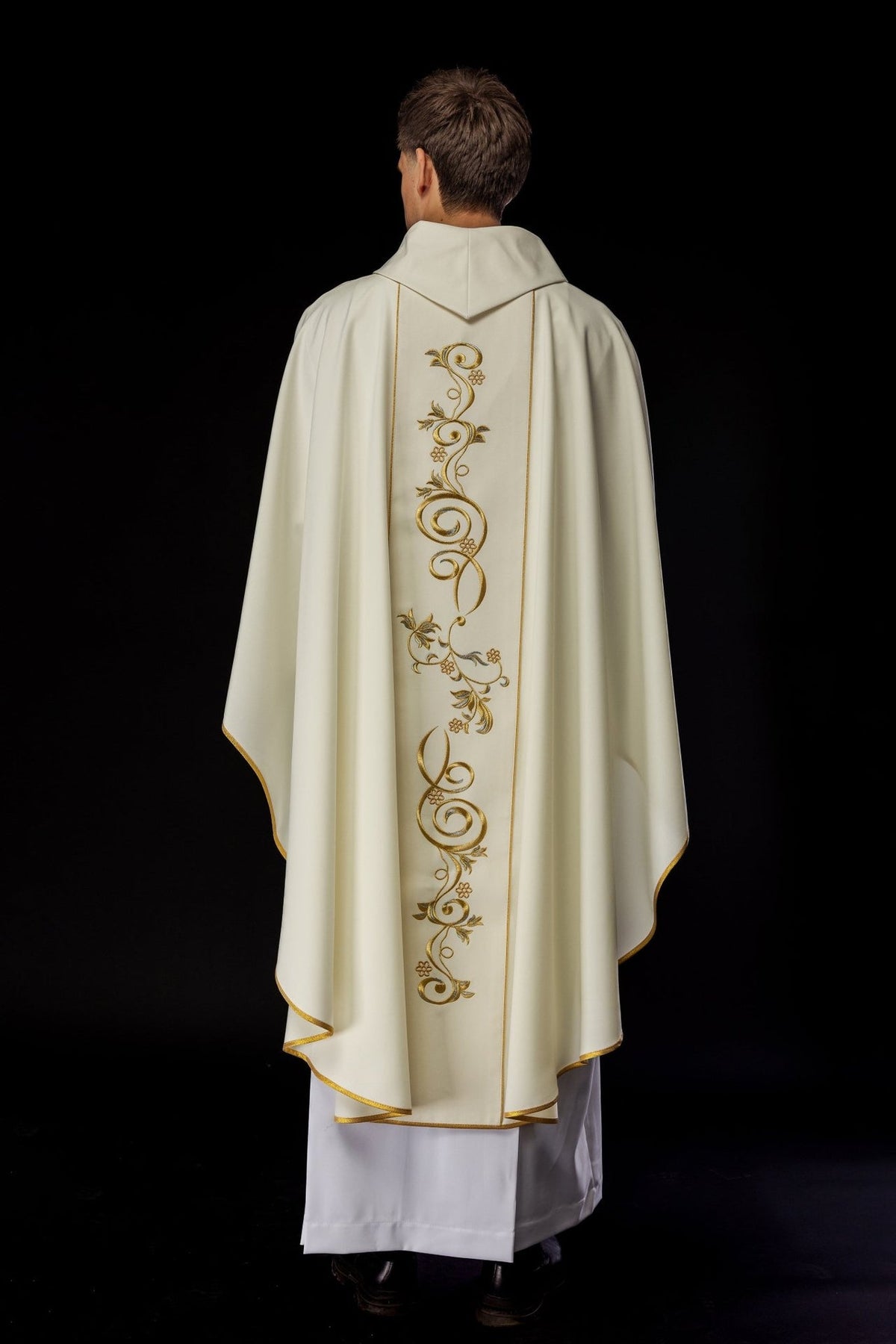 Ivory chasuble back view with full gold scroll embroidery and gold trim